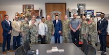 A group of senior leaders pose for a photo