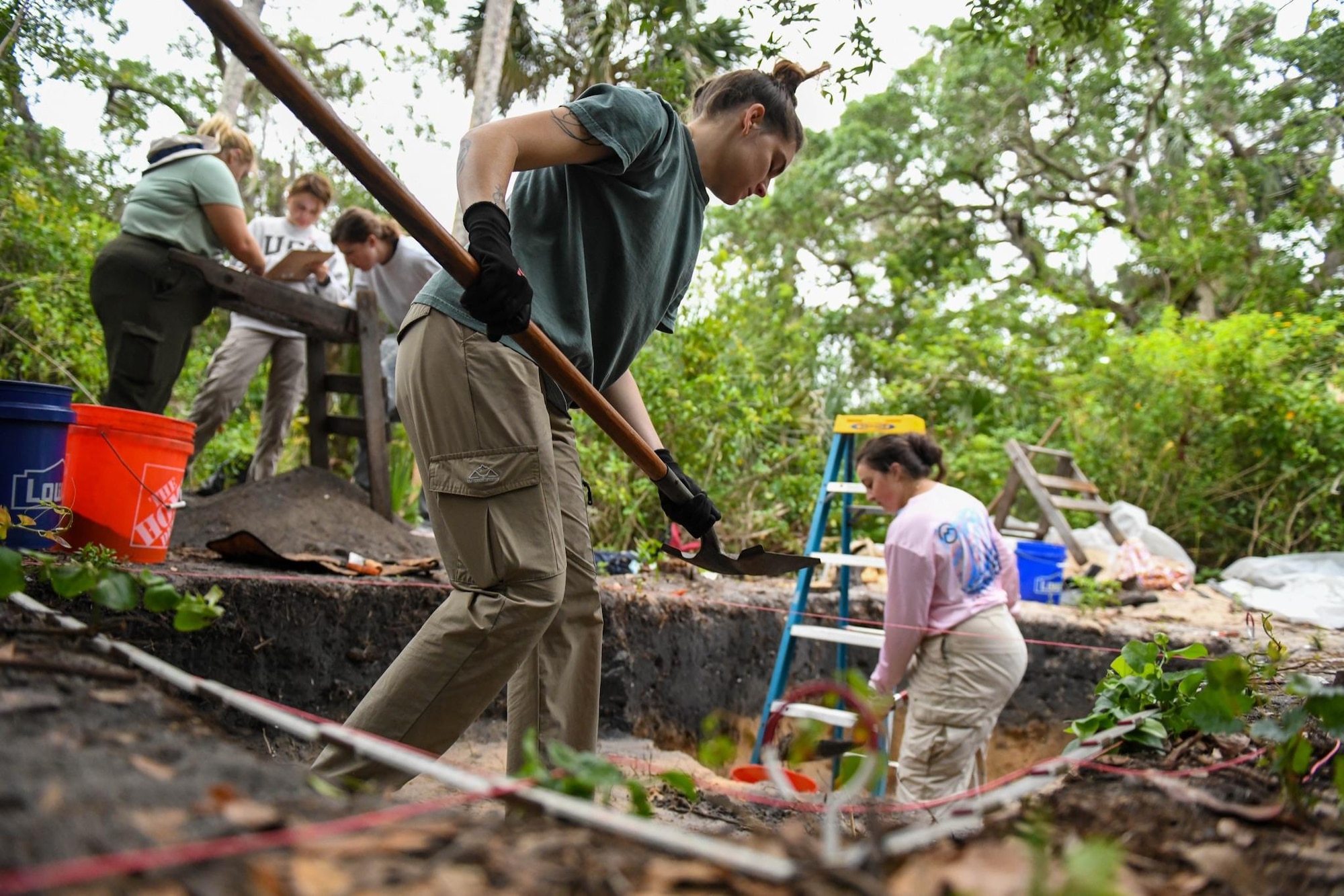 Department of Anthropology students at University of Central Florida excavate a dig site April 12, 2023, at Cape Canaveral Space Force Station, Fla. The artifacts uncovered from these dig sites range from 500 B.C. - A.D. 1565. (U.S. Space Force photo by Senior Airman Samuel Becker)