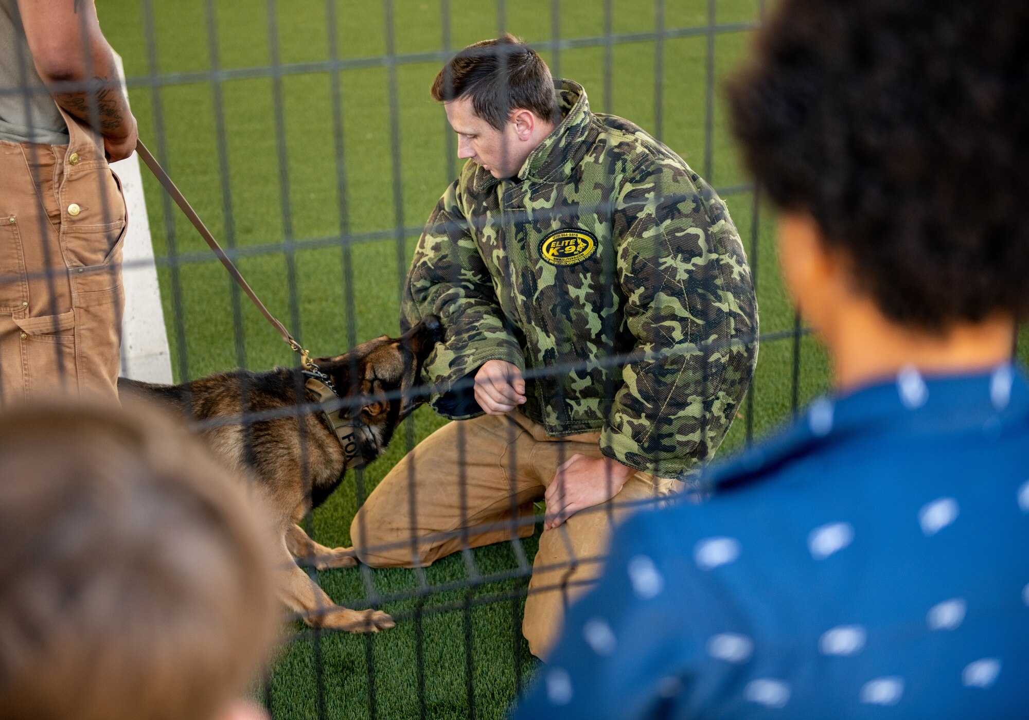 An airmen participates in a military working dog demonstration