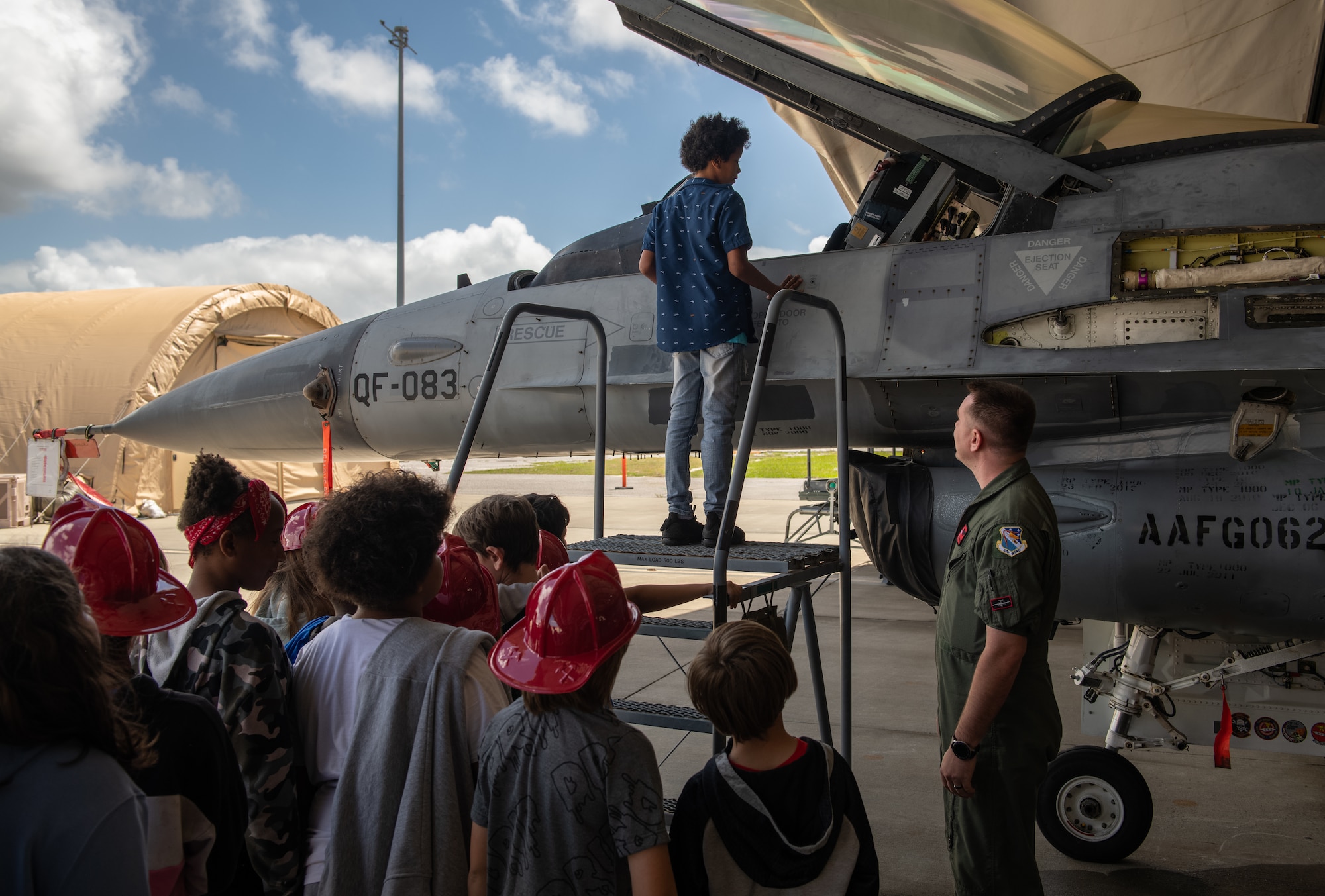 Children look at an aircraft