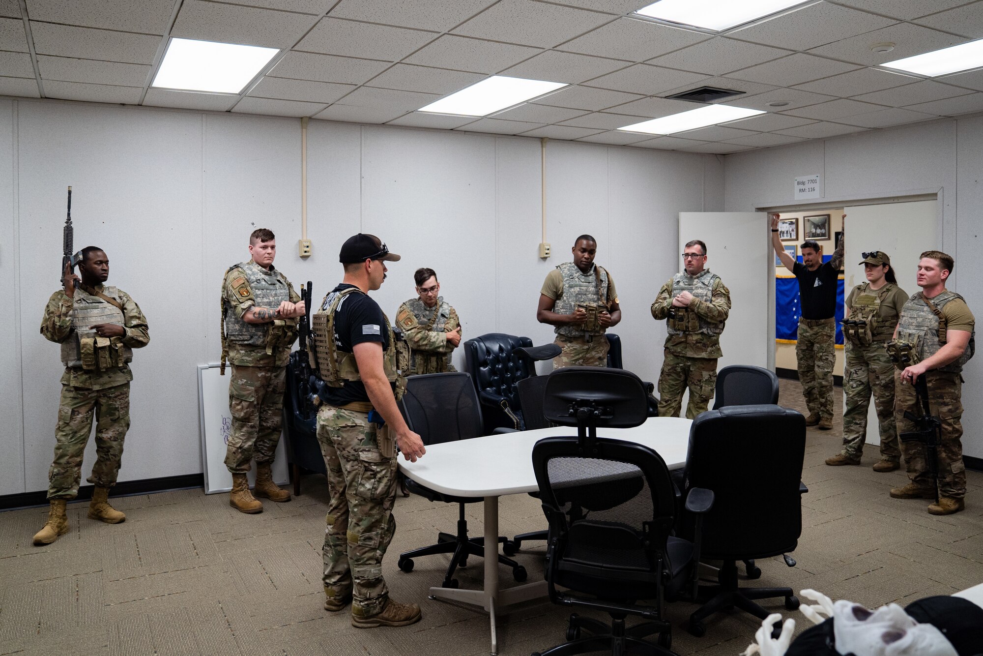 U.S. Air Force Staff Sgt. Michael Dazzo, 5th Combat Communication Support Squadron Combat Readiness lead instructor, gives direction to members of the 85th Engineering Installation Squadron on close quarter battle tactics during MOB school course at Keesler Air Force Base, Mississippi, April 12, 2023. In this course 85th EIS students learn weapons filmization, combative, and other pre deployment tactics.