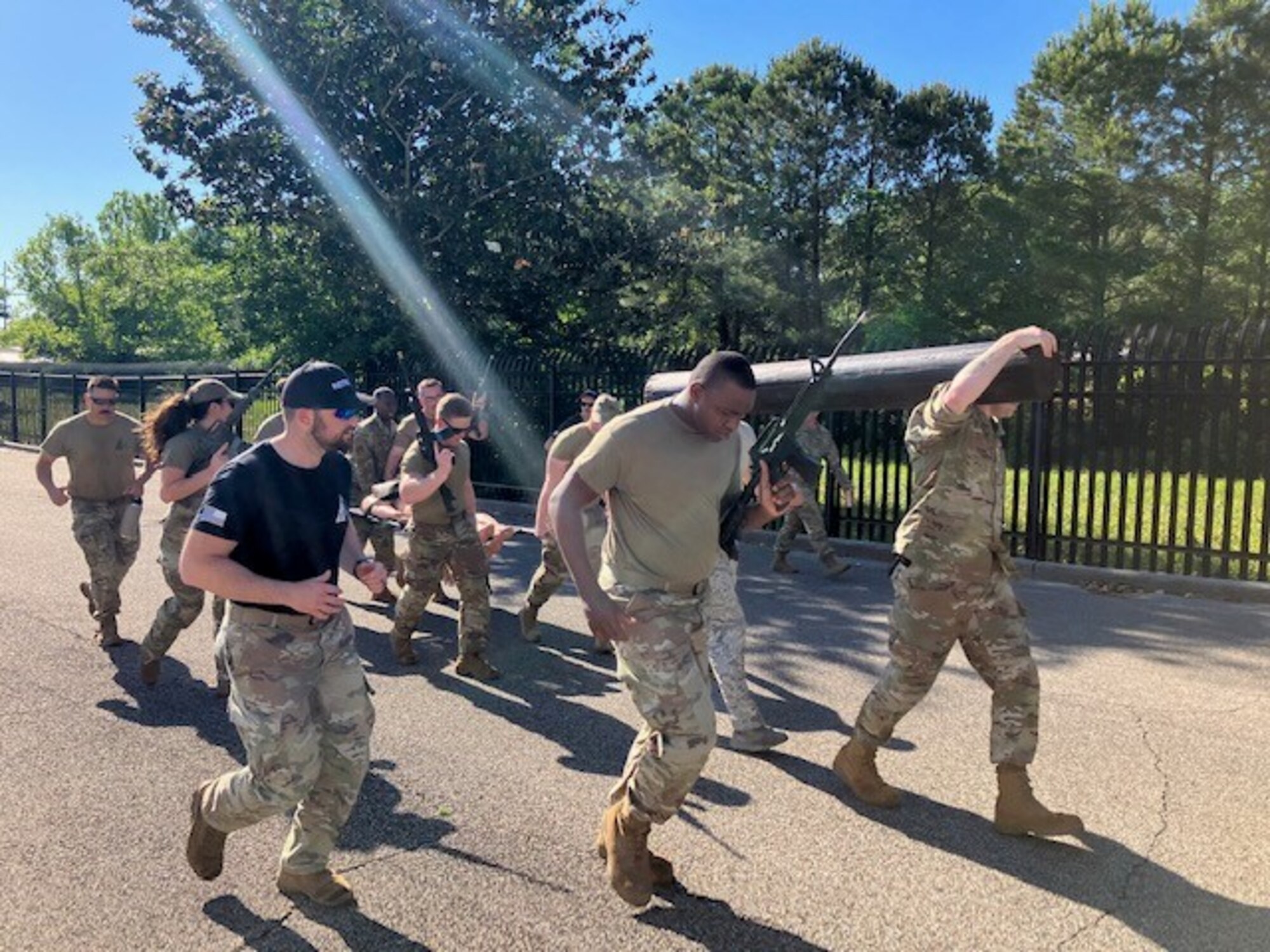 Courtesy photo of members from the 85th Engineering Installation Squadron and the 5th Combat Communications Support Squadron jogging in the first combat readiness course at Keesler, on April 14, 2023.
