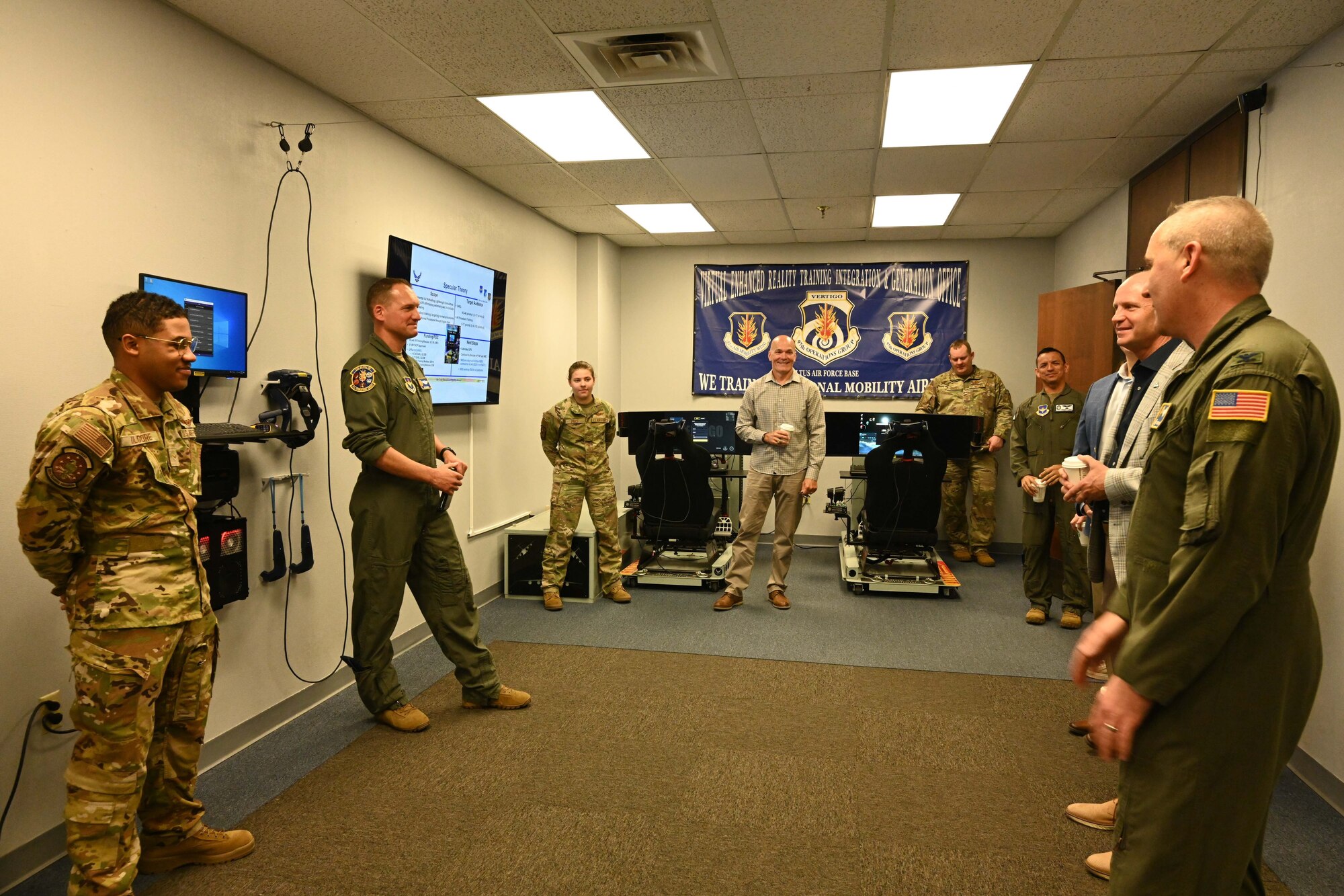 Members from the 97th Operations Group show off new training technology in the “VR Cafe” as part of the second annual “Legacy of the Spear” event at Altus Air Force Base, Oklahoma, April 14, 2023. This year’s event welcomed back the nine previous 97th Air Mobility Wing commanders and command chiefs and 19th Air Force leadership. (U.S. Air Force photo by Airman 1st Class Miyah Gray)