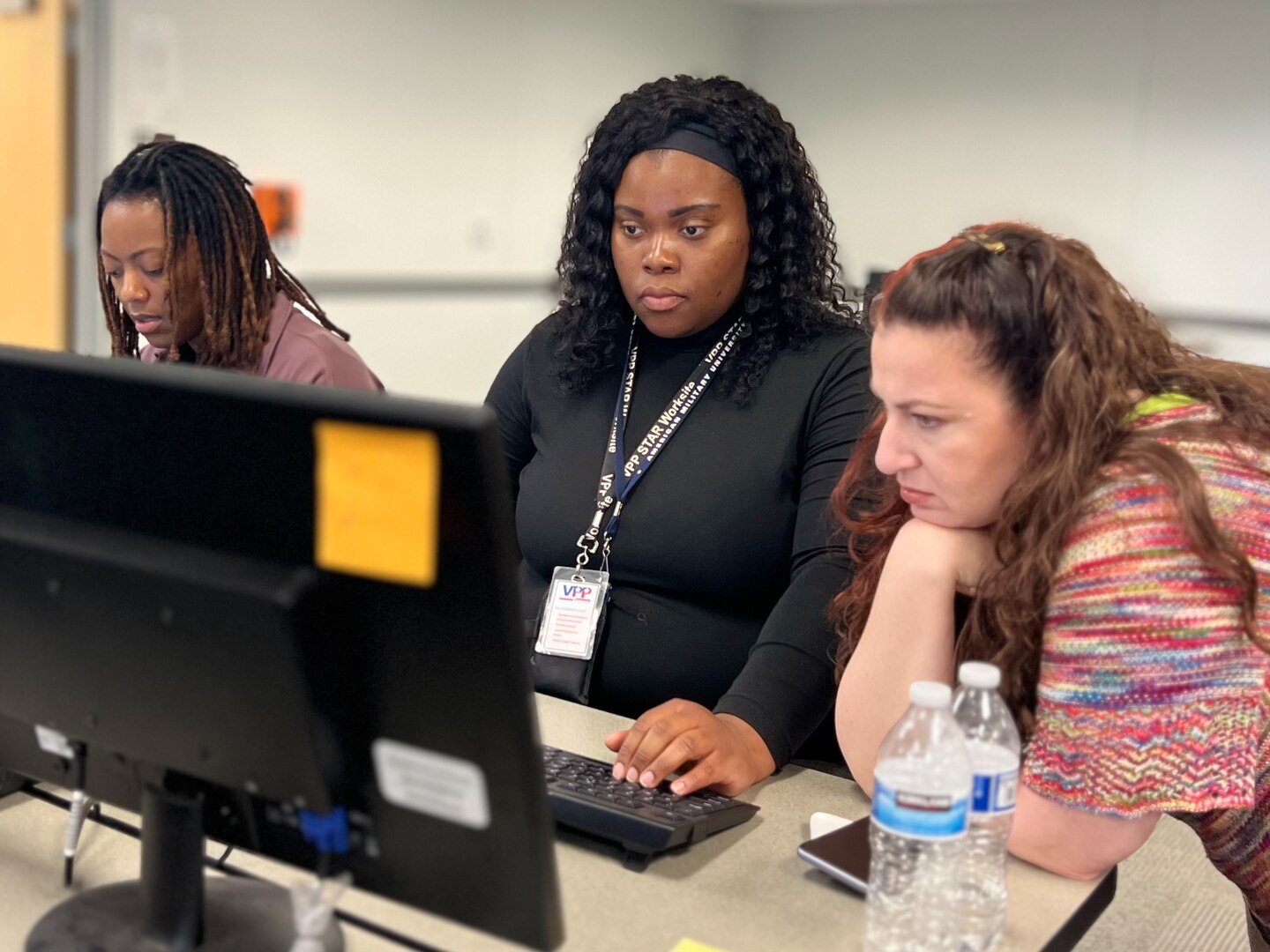 DDJC Natalie Lee Haynes, (left), and Ria Blackwell (right) work on the Warehouse Management System migration April 18, 2023, at DLA Distribution San Joaquin. Photo by Julian Temblador