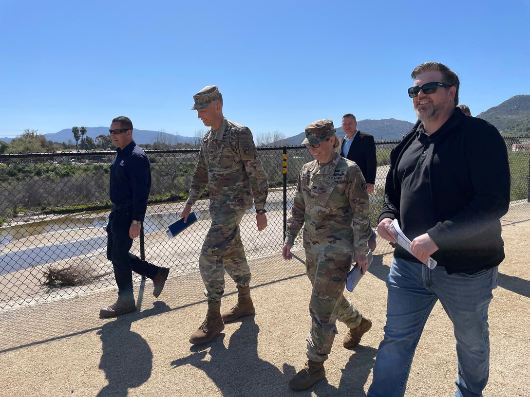Col. Andrew Baker, who is scheduled to assume the role of U.S. Army Corps of Engineers Los Angeles District commander in July, second from left, tours sites April 6 along Murrieta Creek in Temecula, California, alongside Col. Julie Balten, LA District commander, second from right in foreground; Derek Walker, Santa Ana River Mainstem project manager with the LA District, right; Justin Gay, district deputy engineer, background; and Damien Lariviere, Murrieta Creek project manager, left.
