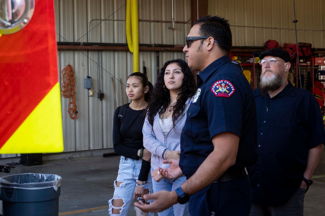 Firefighter Luis Flores with the Combat Center Fire Department shows students an ambulance during the Morongo Unified School District Job Shadow event