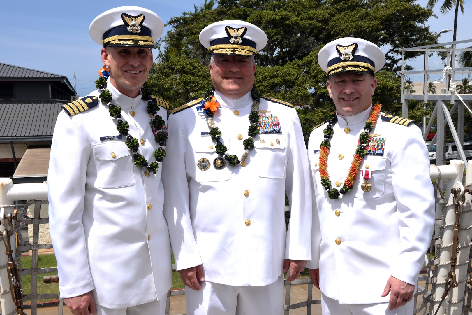 Capt. Brian Krautler, Rear Adm. Matthew Sibley and Capt. Stephen Adler (left to right) pose for a photo after a change of command ceremony for the U.S. Coast Guard Cutter Stratton (WMSL 752) at Base Honolulu, April 17, 2023. Rear Adm. Sibley presided over the ceremony in which Capt. Krautler assumed duties as the ship's new commanding officer. (U.S. Coast Guard photo by Petty Officer 2nd Class Michael Clark)