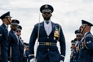 U.S. Air Force Capt. Brian Johnson of the U.S. Air Force Honor Guard Drill Team completes the gauntlet during a performance at the Joint Services Drill Exhibition, April 14, 2023, Washington Monument, Washington, D.C. The Drill Team is an elite unit of 25 Airmen who train, on average, five days a week for eight to ten hours per day to obtain their level of mastery. (U.S. Air Force photo by Kristen Wong)