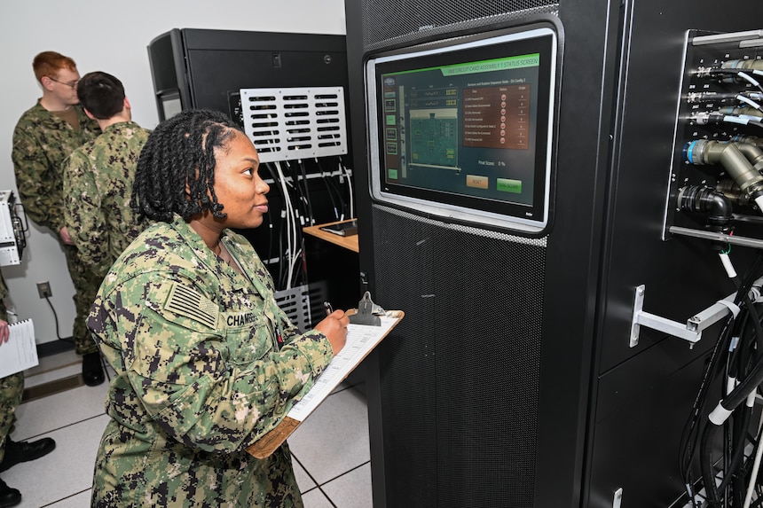 DAHLGREN, Va. (Jan. 27, 2023) Surface Combat Systems Training Command (SCSTC) AEGIS Training and Readiness Center (ATRC) Petty Officer 1st Class Jazmene Chambers practices a circuit card assembly procedure in the Virtual Maintenance Trainer (VMT) Part Task Trainer (PTT) lab. (U.S. Navy photo by Michael Bova)