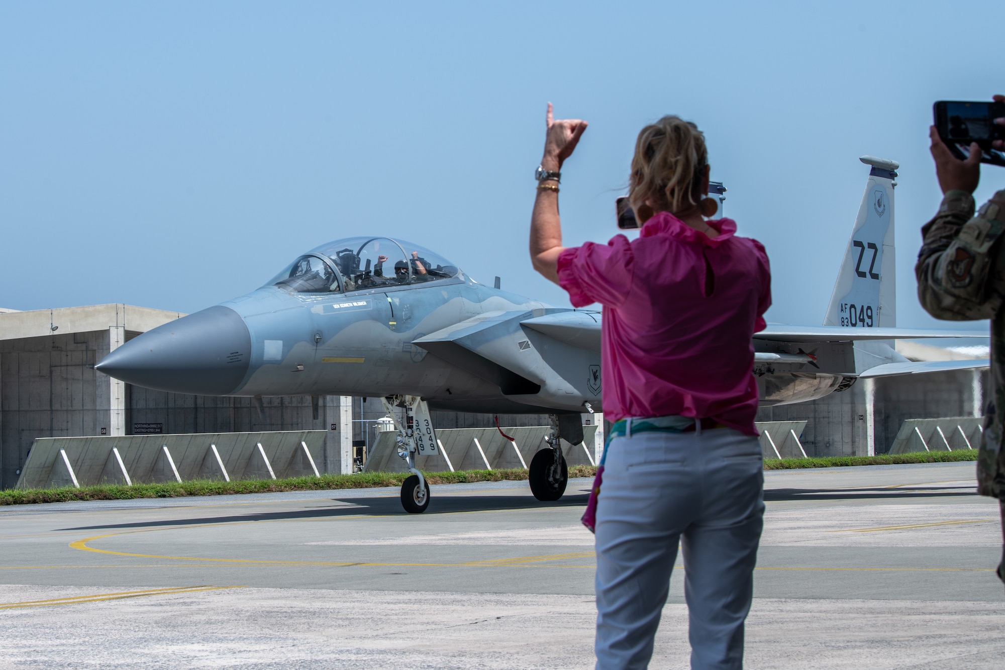 An Airman is greeted by their spouse after a flight.