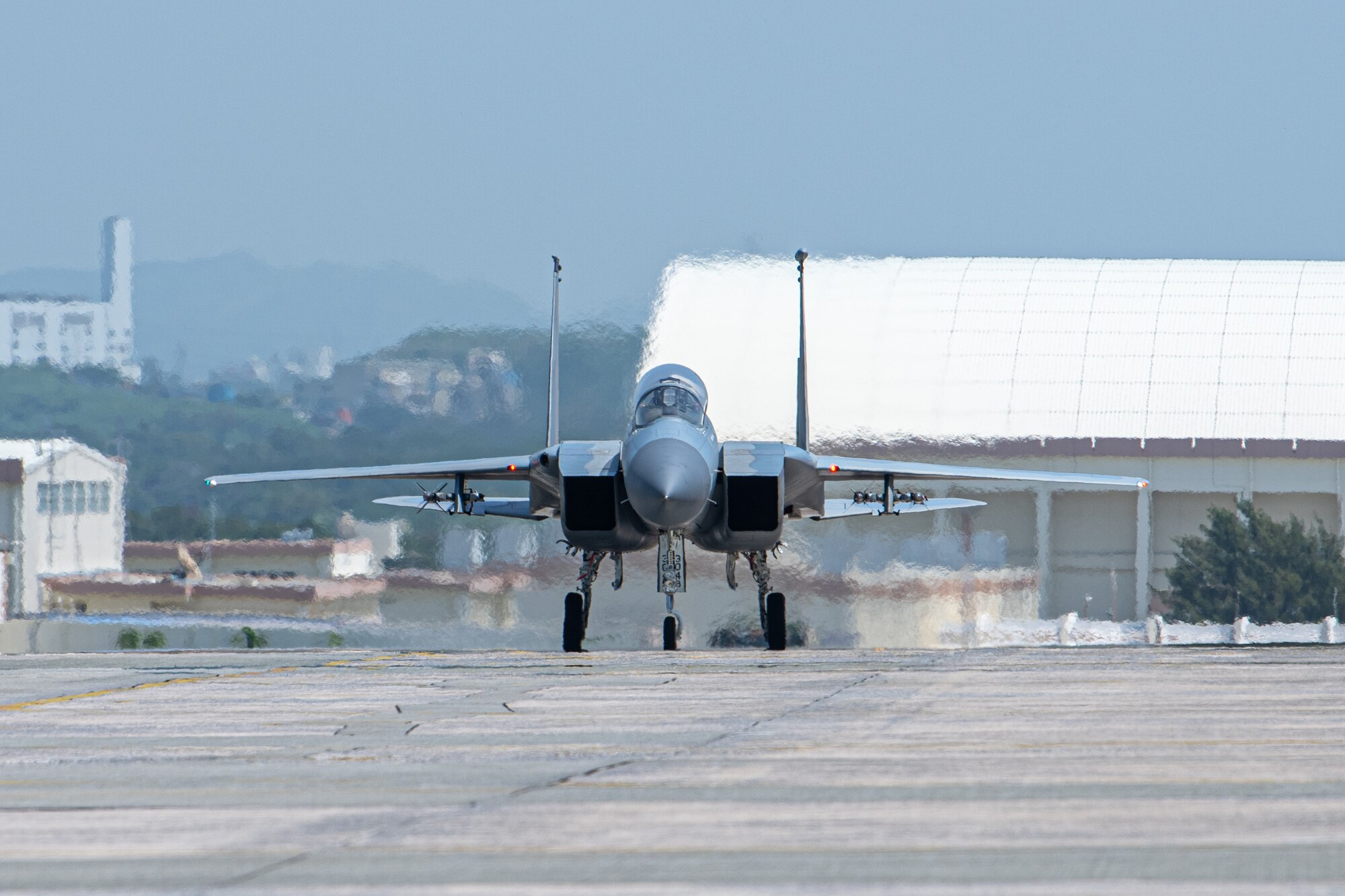 Airmen return from a flight in a jet.