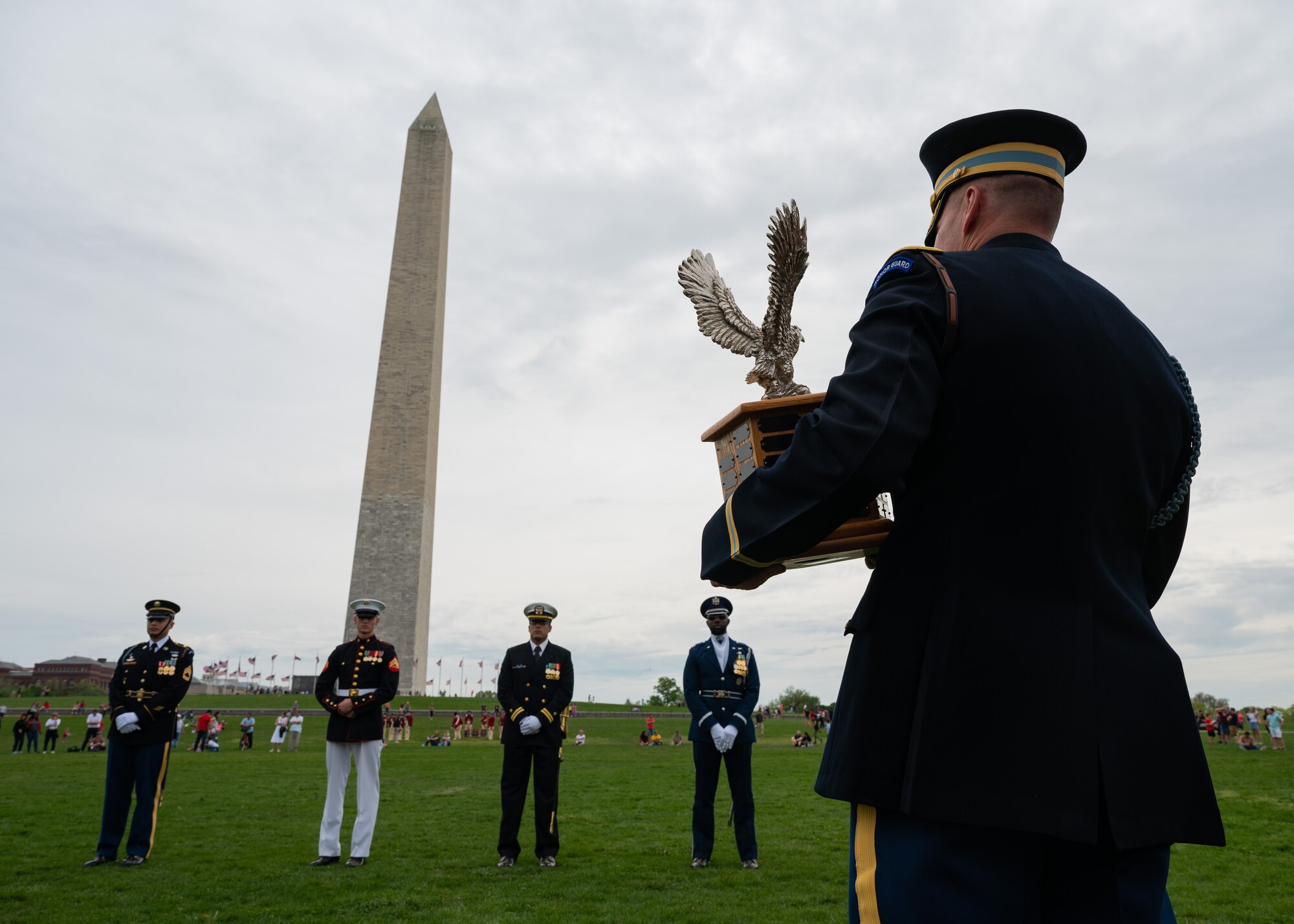 U.S. Army Col. David B. Rowland, commander of 3d U.S. Infantry Regiment (The Old Guard), awaiting to announce the winner of the Joint Services Drill Exhibition, April 14, 2023, at the Washington Monument, Washington, D.C. The event brought together drill teams from the U.S. Air Force, Army, Navy, Marine Corps and Coast Guard to compete for the most superlative display of precision, discipline and teamwork. (U.S. Air Force photo by Airman 1st Class Bill Guilliam)