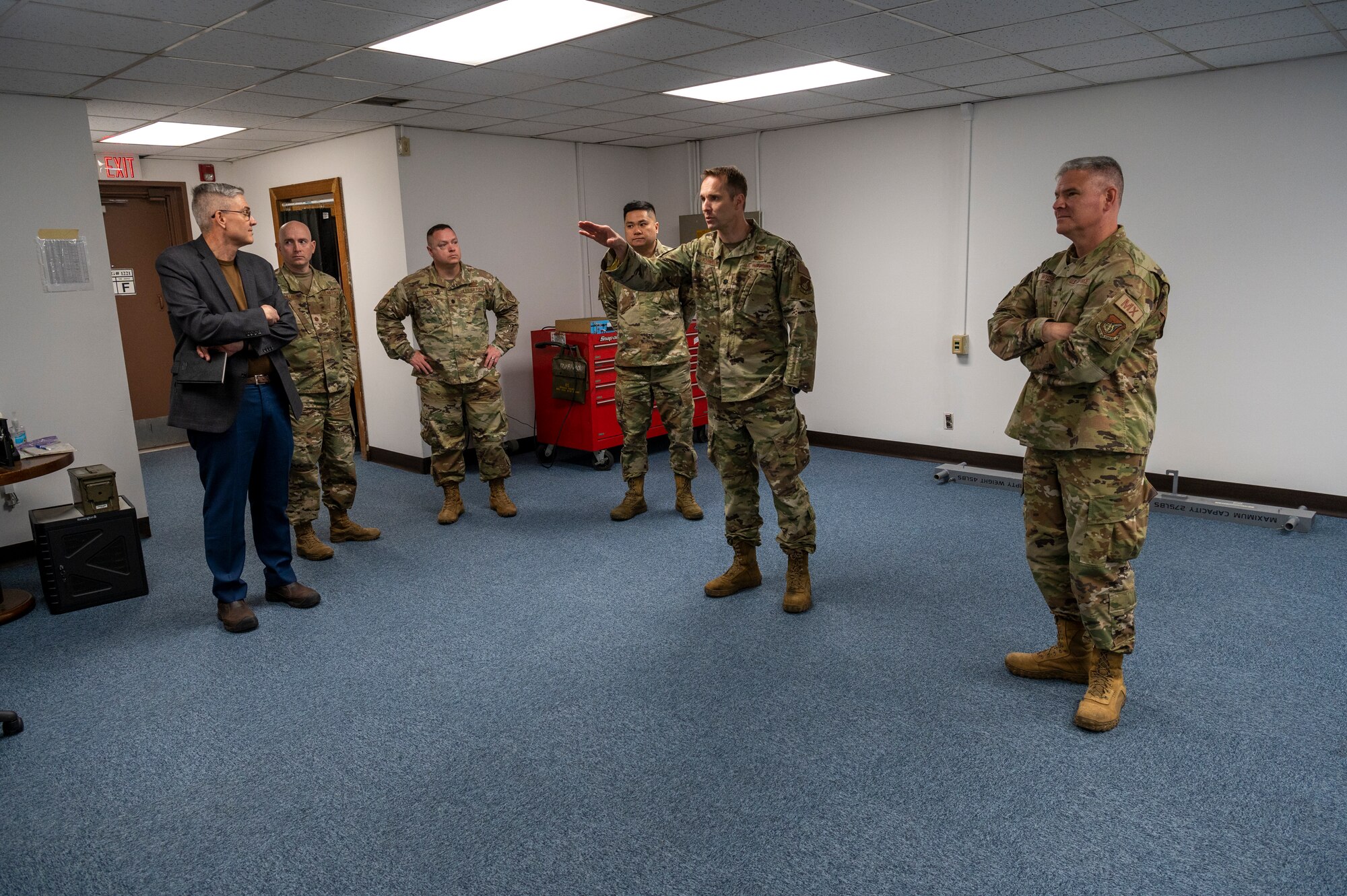 U.S. Air Force Lt. Col. Scott Kubalek, 51st Munitions Squadron commander, middle, gives Col. Todd Wydra, 51st Maintenance Group commander, right, a tour of the newly renovated MUNS facility at Osan Air Base, Republic of Korea, April 12, 2023. Renovating the facility gave Airmen visiting from Kunsan Air Base, ROK, their own environment to work in, alleviating space constraints on the flight line. (U.S. Air Force Photo by Airman 1st Class Aaron Edwards)