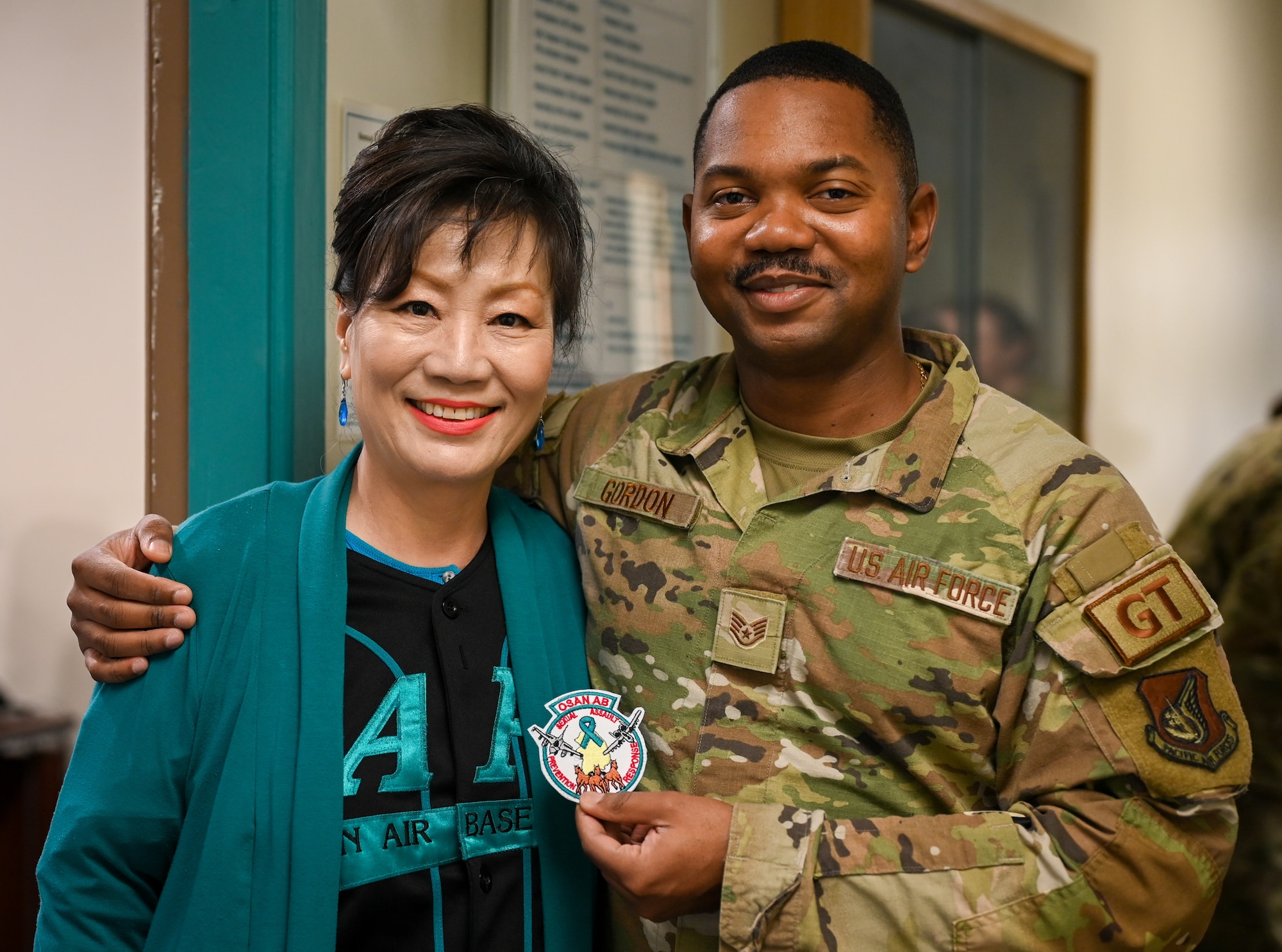 Sukie White, 51st Fighter Wing Sexual Assault Prevention Response victim advocate specialist, poses for a photo with U.S. Air Force Staff Sgt. Mikhail Gordon, 51st Logistics Readiness Squadron volunteer victim advocate, at Osan Air Base, Republic of Korea, Apr. 11, 2023. April Sexual Assault Awareness and Prevention month and this year’s theme is “Step forward. Prevent. Report. Advocate.” (U.S. Air Force Photo by Staff Sgt. Kelsea J. Caballero)