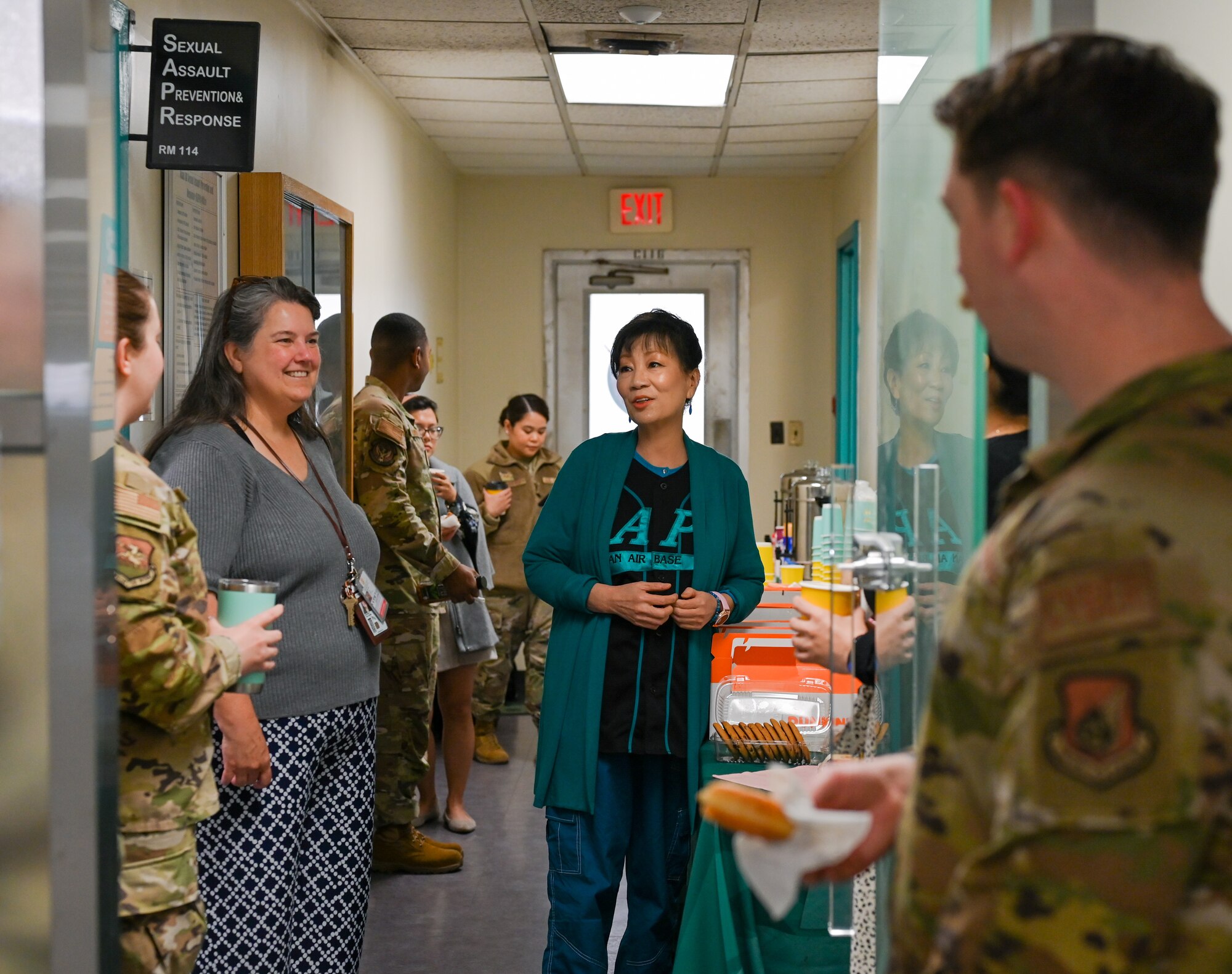 Sukie White, 51st Fighter Wing Sexual Assault Prevention Response victim advocate specialist, interacts with guests at the SAPR open house at Osan Air Base, Republic of Korea, Apr. 11, 2023. The DOD promotes Sexual Assault Awareness & Prevention Month to military and civilian communities to prevent sexual assault and foster a culture of education. (U.S. Air Force Photo by Staff Sgt. Kelsea J. Caballero)