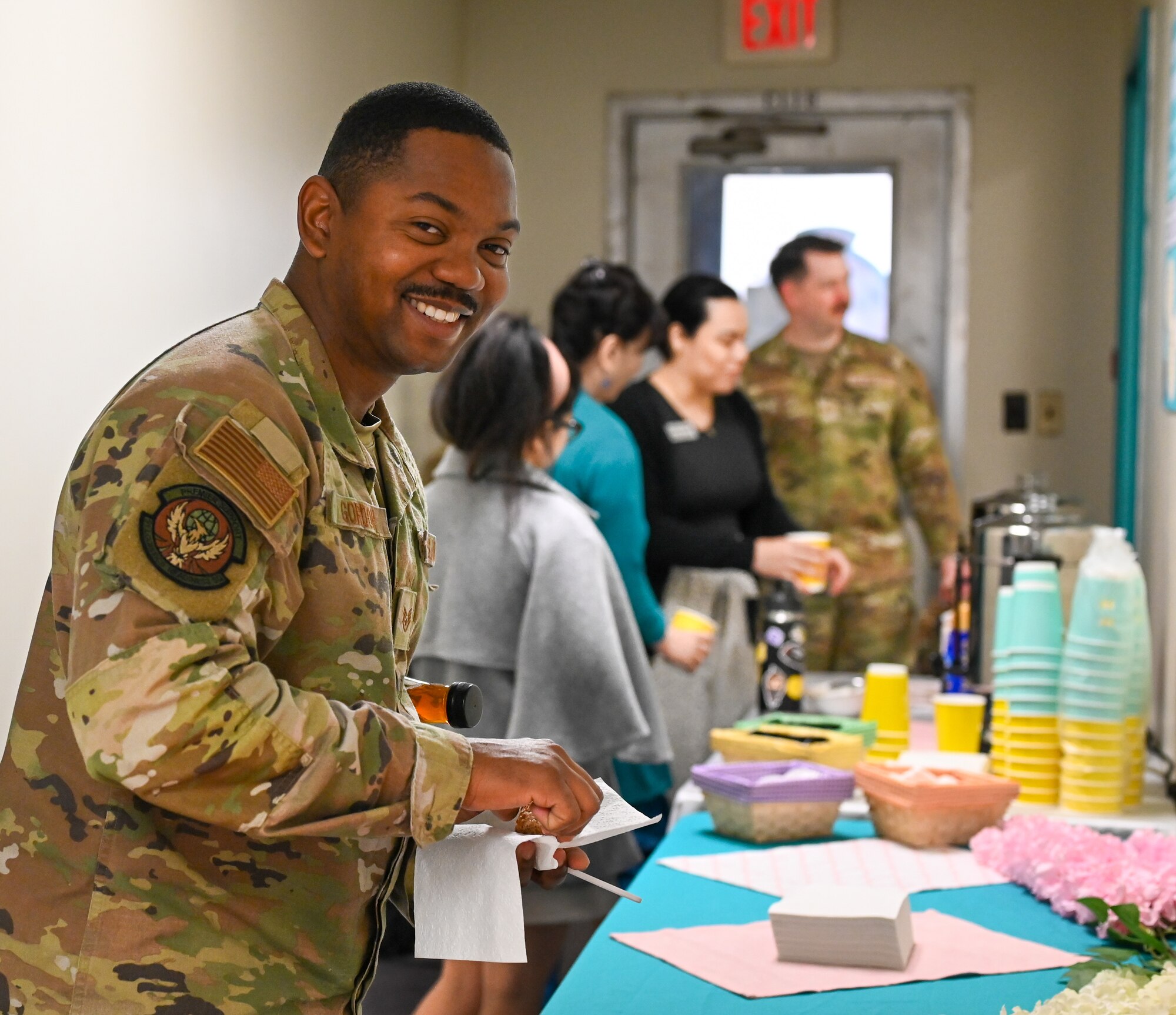 U.S. Air Force Staff Sgt. Mikhail Gordon, 51st Logistics Readiness Squadron volunteer victim advocate, gets refreshments at the Sexual Assault Awareness and Prevention Month open house at Osan Air Base, Republic of Korea, Apr. 11, 2023. The open house highlighted victim advocates and this year’s theme of “Step forward. Prevent. Report. Advocate.” (U.S. Air Force Photo by Staff Sgt. Kelsea J. Caballero)