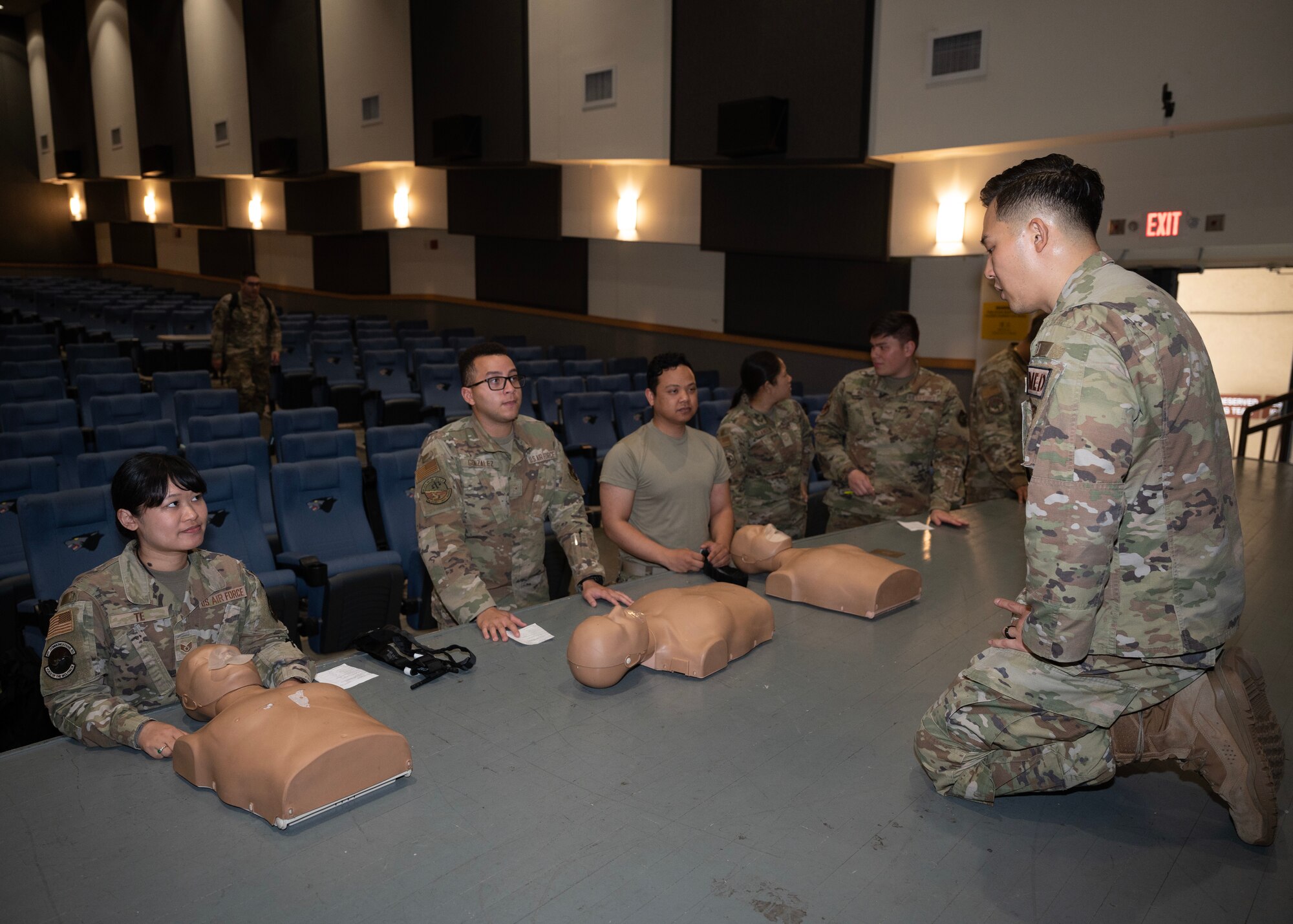 Tech. Sgt. Chang Park, 8th Medical Group flight chief of education and training, teach a group of Airmen on how to apply tactical field care to a patient at Kunsan Air Base, Republic of Korea, Apr. 18, 2023.