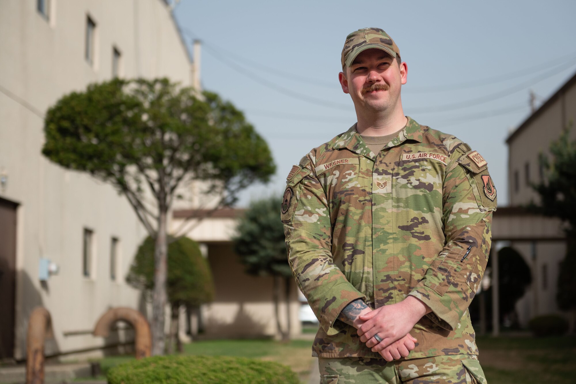 U.S. Air Force Senior Airman Austin Wegner, 51st Communications Squadron volunteer victim advocate, poses for a photo during Sexual Assault Awareness and Prevention Month at Osan Air Base, Republic of Korea, Apr. 12, 2023.