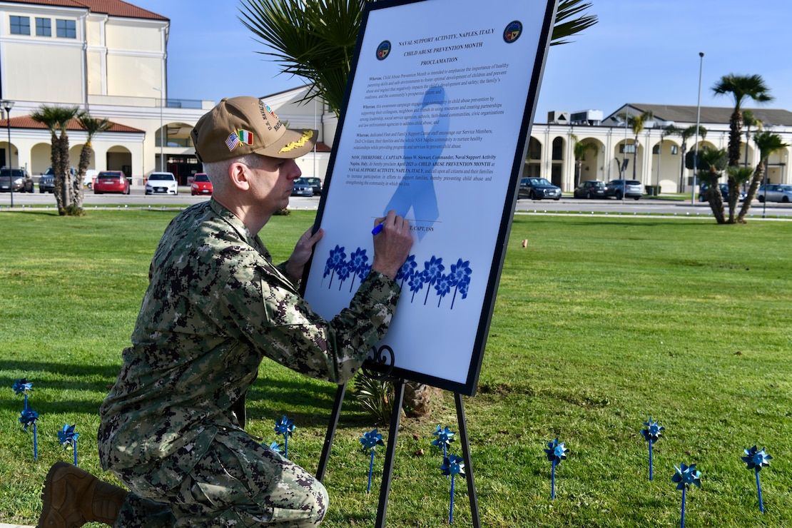 NAPLES, Italy (March 31, 2023) U.S. Naval Support Activity (NSA) Naples Commanding Officer Capt. James Stewart signs a proclamation declaring April as Child Abuse Prevention Month onboard NSA Naples in Gricignano di Aversa, Italy, March 31, 2023. NSA Naples is an operational ashore base that enables U.S., allied, and partner nation forces to be where they are needed, when they are needed to ensure security and stability in the European, African, and Central Command areas of responsibility. (U.S. Navy photo by Aaliyah Essex)