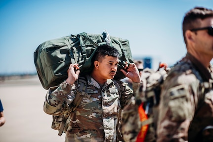 Citizen-Soldiers with 1st Battalion, 179 Infantry Regiment, Oklahoma Army National Guard, prepare to board a plane in Oklahoma City April 17, 2023, bound for Fort Bliss, Texas. Task Force Tomahawk will take part in post-mobilization training before deploying to the Horn of Africa.