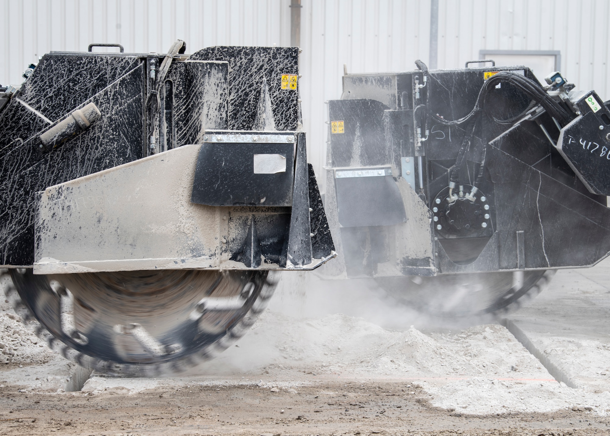 A compact track loader equipped with a 60 inch saw blade cuts into concrete during Rapid Airfield Damage Recovery training at Ramstein Air Base, Germany, April 11, 2023.