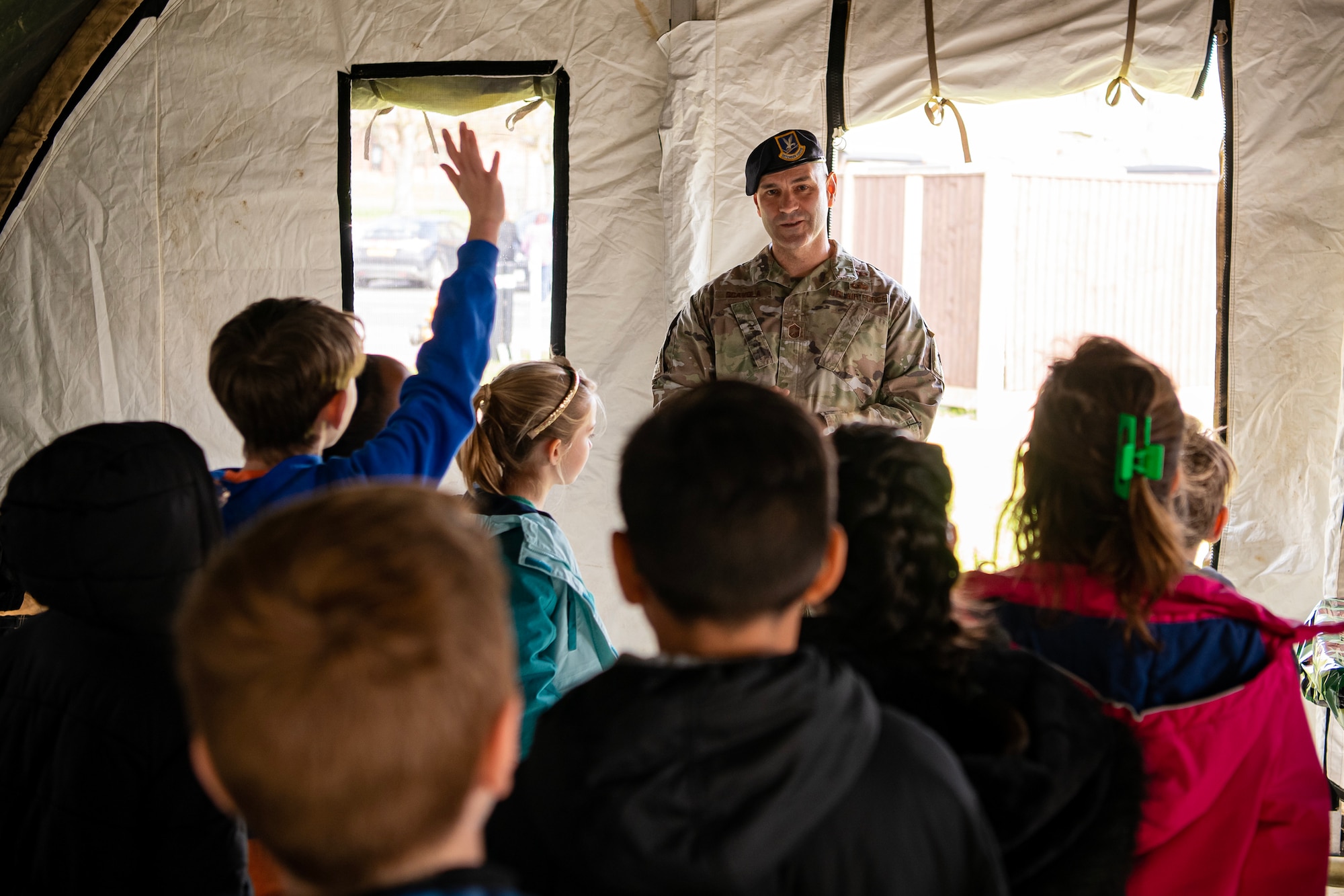 U.S. Air Force Chief Master Sgt. Richard Scavola, 423d Air Base Group Senior Enlisted leader, speaks to Alconbury Elementary School students during Camp Kudos at RAF Alconbury, England, April 14, 2023. The camp gave students the opportunity to experience and learn about various aspects of deployment preparation and the wing mission. (U.S. Air Force photo by Staff Sgt. Eugene Oliver)