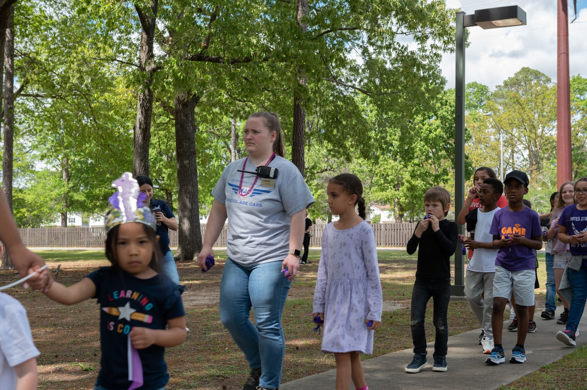 Children and teachers at the 4th Force Support Squadron Child Development Center and Youth Center march in the Purple Up Parade to recognize the Month of the Military Child at Seymour Johnson Air Force Base, North Carolina, April 14, 2023. The parade was held to honor and celebrate military children during the Month of the Military Child. (U.S. Air Force photo by Rebecca Sirimarco-Lang)