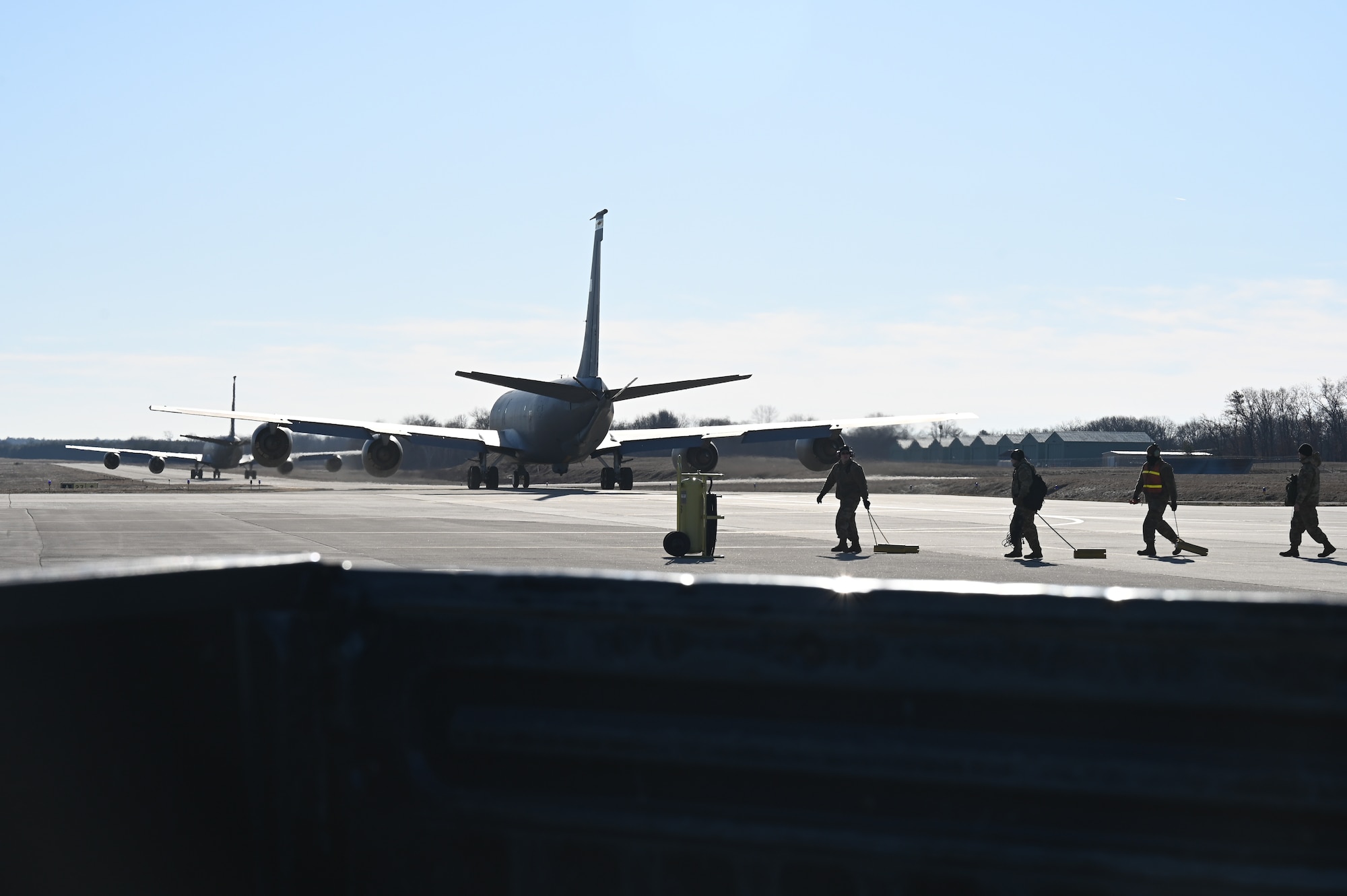 The 168th Maintenance Group Crew Chiefs and Multi-capable Crew Chiefs pull chalks after sending off two KC-135 Stratotankers for air refueling missions, April 5, 2023. The 168th Wing took part in a multi-day flyaway readiness exercise focused on the Department of the Air Force’s priority of Agile Combat Employment. (U.S. Air National Guard photo by Senior Master Sgt. Julie Avey)