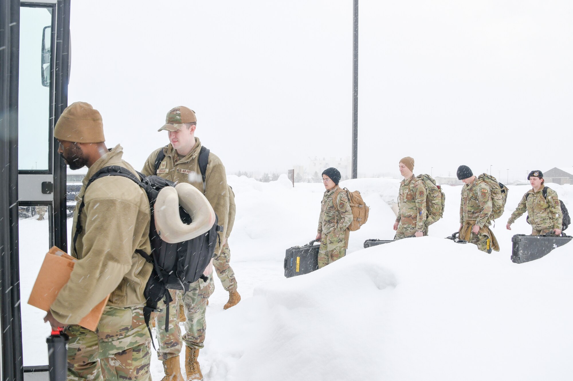 Airmen from the 168th Wing, Alaska Air National Guard, load into a 168th Logistics Readiness Squadron bus at Eielson Air Force Base in preparation for transport aboard the wing’s KC-135 Stratotankers to Volk Field, Wisconsin, April 2, 2023. The multi-day, flyaway readiness exercise focused on the Department of the Air Force’s priority of Agile Combat Employment, which uses multi-capable Airmen to increase operational resiliency and survivability while generating combat air power. (U.S. Air National Guard photo by Senior Master Sgt. Julie Avey)