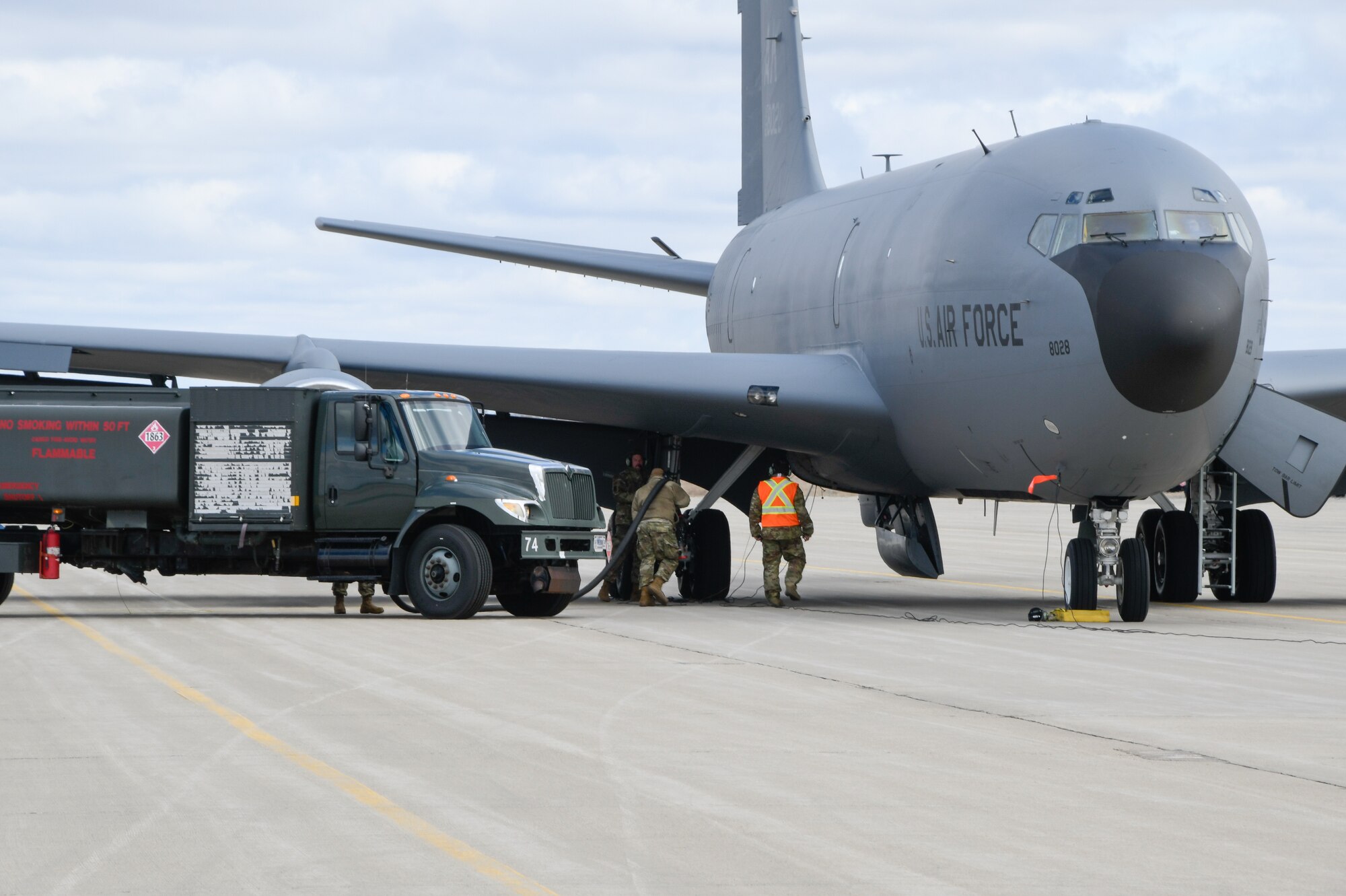 Airmen of the 168th Wing Logistics Readiness Squadron Fuels Management Flight and the 168th Wing Maintenance Group participated in hot pit refueling a KC-135 Stratotanker during a readiness exercise at Volk Field, Wisconsin, April 5, 2023. The hot pitting exercise was the first time the 168th LRS Fuels Management flight had taken part in hot pitting operations. Hot pitting occurs immediately after landing while engines are still running, reducing response times for the redeployment of the KC-135 Stratonker to continue air refueling operations generating combat air power. (U.S. Air National Guard photo by Senior Master Sgt. Julie Avey)