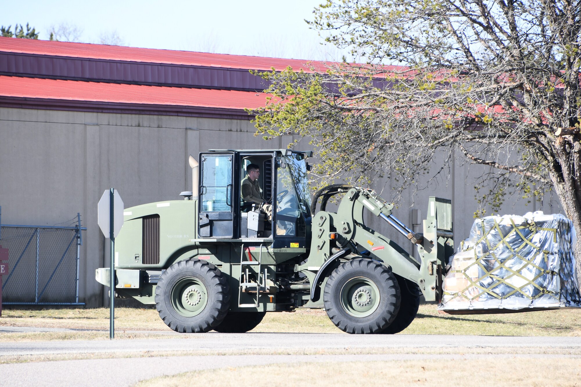 Airmen of the 168th Wing, Logistics Readiness Squadron, drive military forklifts while in charge of cargo movement during a multi-day readiness exercise at Volk Field, Wisconsin, April 1-7, 2023. The multi-day flyaway readiness exercise focused on the Department of the Air Force’s priority of Agile Combat Employment, which uses multi-capable Airmen to increase operational resiliency and survivability while generating combat air power. (U.S. Air National Guard photo by Senior Master Sgt. Julie Avey)