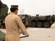 U.S. Marine Sgt Jonathan Alvarez, an evaluator with the Amphibious Combat Vehicle Transition Training Unit, watches an ACV at Marine Corps Base Camp Pendleton, California, Apr. 11, 2023. The ACV TTU is composed of a cadre of experienced assault amphibian Marines working to create a standardized program to certify Marines to operate and maintain ACVs. As part of a Headquarters Marine Corps initiative, once operational, the ACV TTU will certify ACV crewmembers, vehicle commanders, maintainers, and unit leadership on the safe operation, maintenance, supervision, and employment of the ACV.