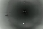 A grainy photo shows objects flying.