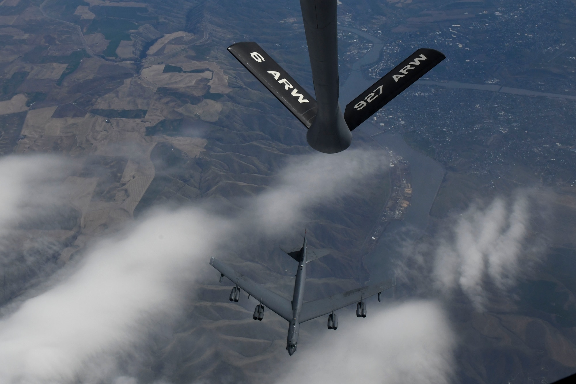 A B-52 Stratofortress flies next to a KC-135 Stratotanker assigned to the 6th Air Refueling Wing, during exercise Global Thunder 23, April 16, 2023.  Global Thunder is an annual command and control exercise designed to train U.S. Strategic Command forces and assess joint operations readiness. (U.S. Air Force photo by Capt Teri L. Bunce)