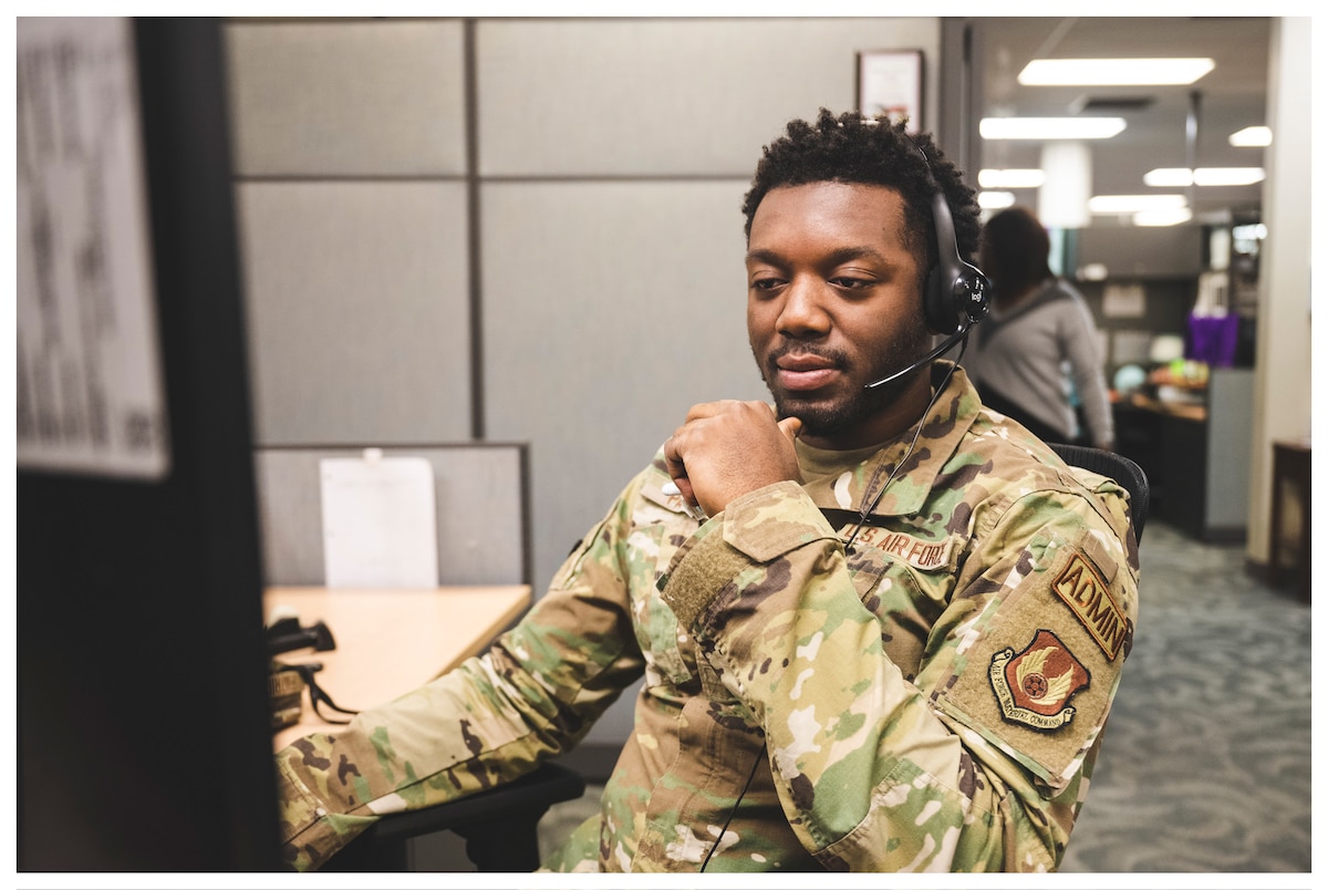 Airman Patrick Corde, 88th Comptroller Squadron command support staff journeyman, speaks with a customer Jan. 19 at Wright-Patterson Air Force Base, Ohio.