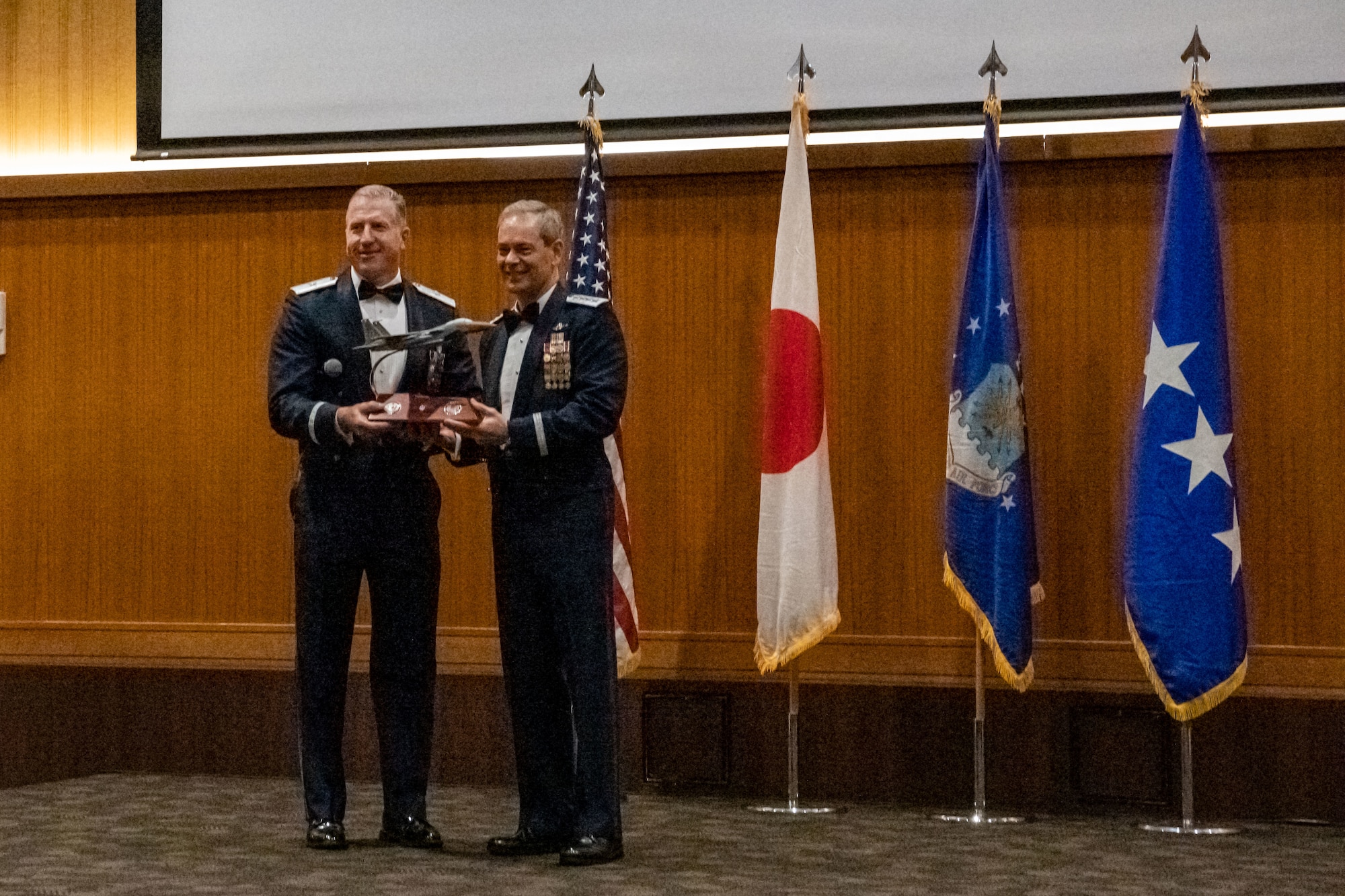 Airmen hold a reward.