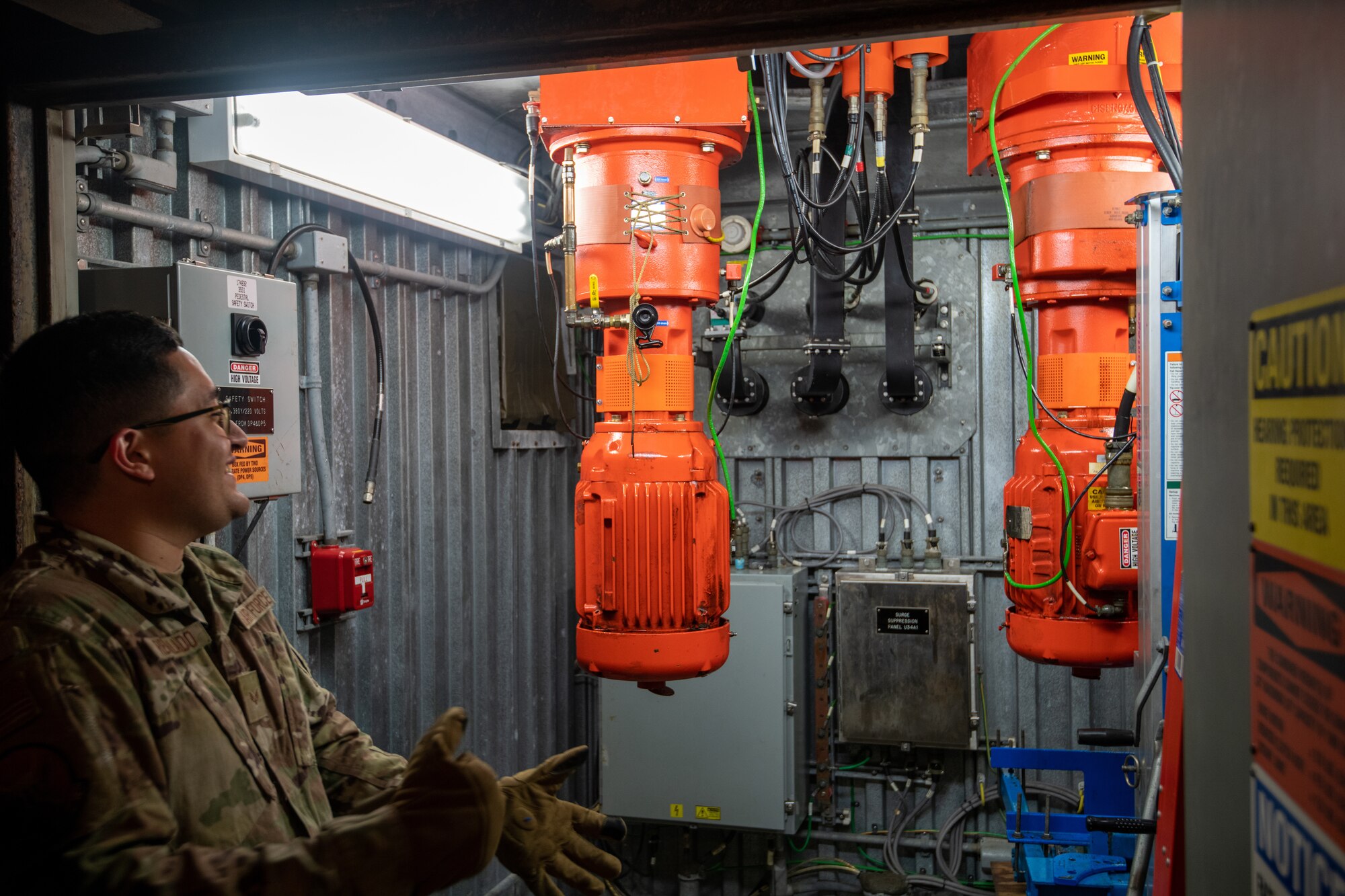 Senior Airman explaining the purpose of the dual motor system of the radar.
