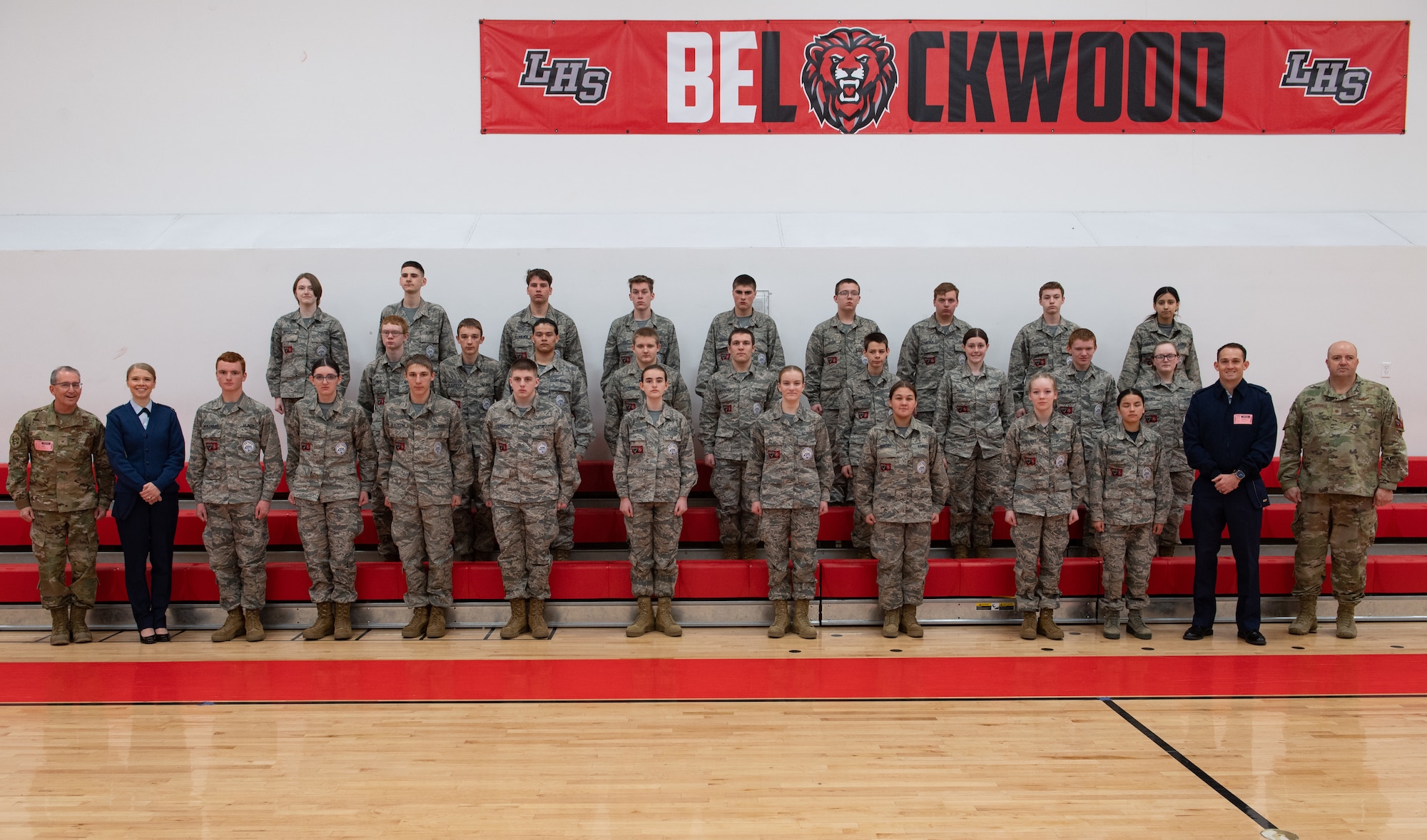 Members of the Lockwood High School Air Force Junior Reserve Officer Training Corps, Air Force Recruiting Service and Montana Air National Guard pose for a group photo at Lockwood High School, Billings, Montana, April 14, 2023
