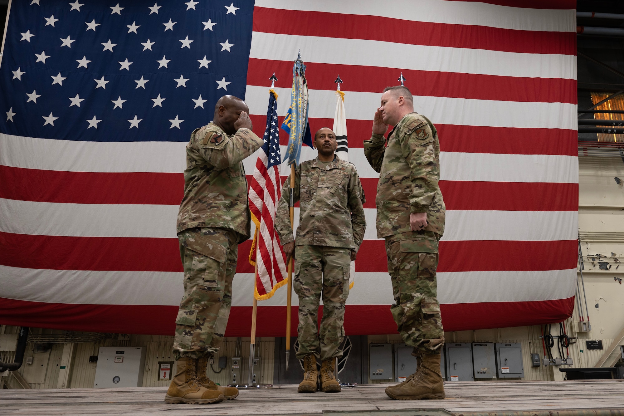 Col. Bradley Altman (right), incoming 8th Maintenance Group commander, salutes Col. Henry R. Jeffress III (left), 8th Fighter Wing commander, during the 8th MXG assumption of command ceremony at Kunsan Air Base, Republic of Korea, Apr. 10, 2023.