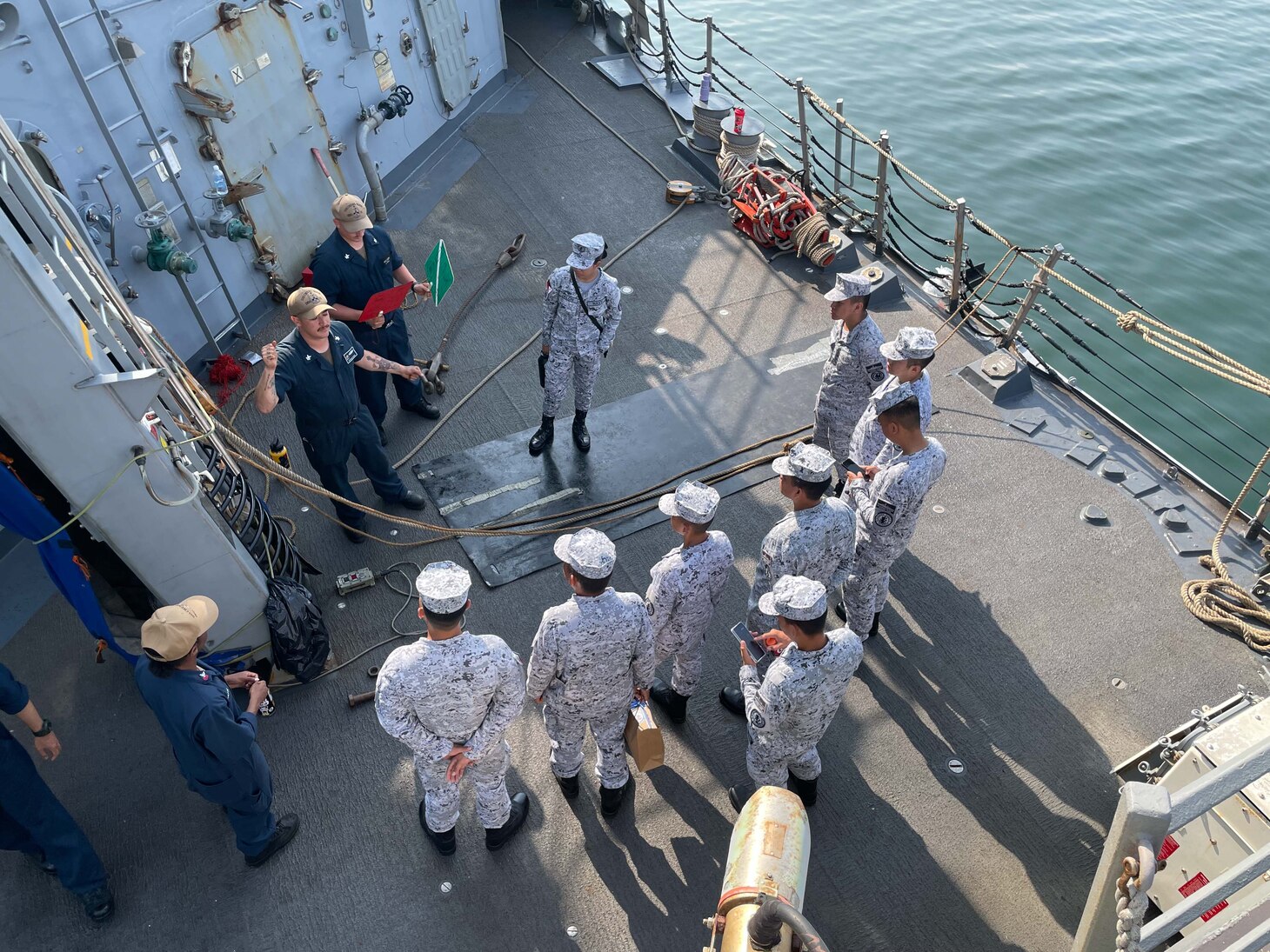 SUBIC BAY, PHILIPPINES (April 17, 2023) Boatswain’s Mate 2nd Class Josemaria Garcia gives underway replenishment training to Philippine Navy Sailors assigned to the Phoang-class corvette BRP Conrado Yap (PS 39) aboard the Arleigh Burke-class guided-missile destroyer USS Chung-Hoon (DDG 93). USS Chung-Hoon is on a routine deployment to U.S. 7th Fleet and is assigned to Commander, Task Force (CTF 71)/ Destroyer Squadron (DESRON) 15. CTF 71/DESRON 15 is the largest forward-deployed DESRON and the U.S. 7th Fleet’s principal surface force. (U.S. Navy photo by Mass Communication Specialist 1st Class Andre T. Richard)
