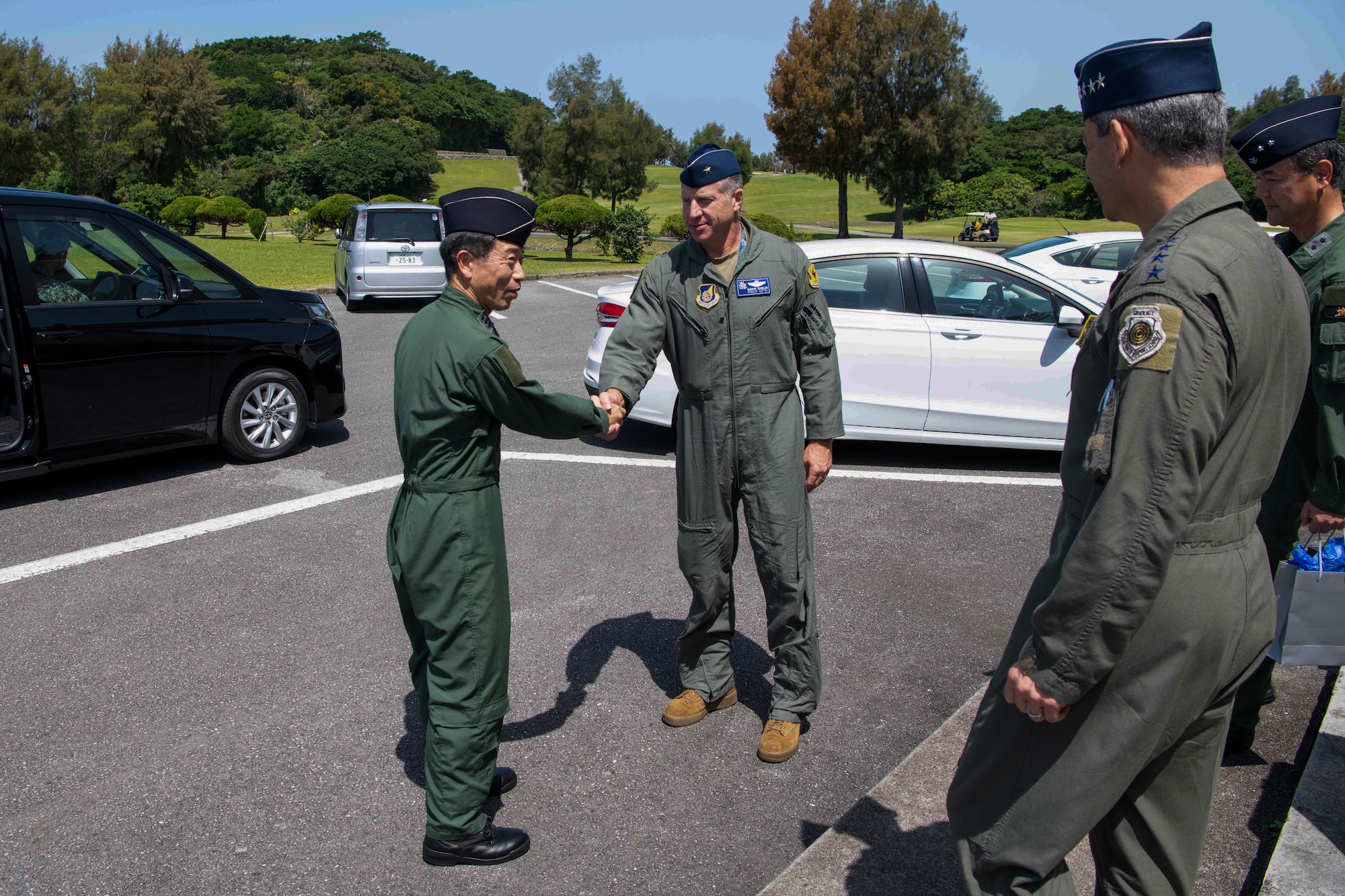 U.S. Air Force Brig. Gen. Dave Eaglin, 18th Wing commander, shakes hands with Japan Air Self-Defense Force Lt. Gen. Masahito Yajima, Southwestern Air Defense Force commander, at Kadena Air Base, Japan, April 16, 2023. Cooperation among Allies and partners is critical in deterring aggression and enhancing interoperability allowing our forces to counter military aggression by sharing responsibilities for common defense. (U.S. Air Force photo by Airman 1st Class Jonathan R. Sifuentes)