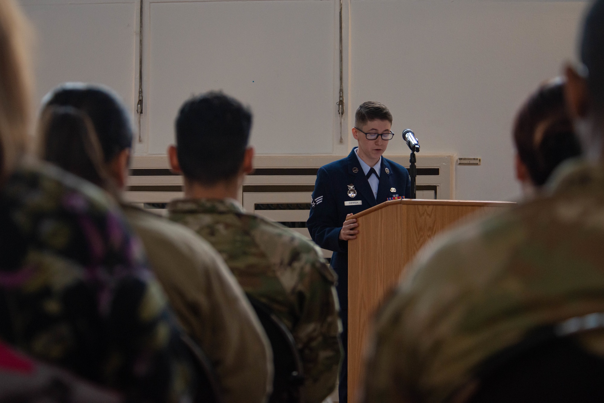 Event narrator speaks at a ceremony