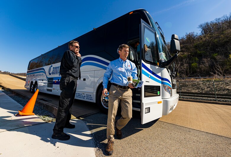 Joseph Savage, the Regional Business Director with the U.S. Army Corps of Engineers Great Lakes and Ohio River Division, steps off the bus with members of the Inland Waterways Users Board for a tour of the Monongahela River Locks and Dam 4 at Charleroi, Pennsylvania, April 12, 2023.

The U.S. Army Corps of Engineers Pittsburgh District hosted the tour and several briefings about ongoing and future inland navigation construction projects within the district.

During the tour, Inland Waterways User Board (IWUB) members learned about the overall Lower Monongahela River navigation project and the new river chamber construction at Charleroi, which is in its final phase after nearly 20 years of construction. Members also listened to briefings about the overall Upper Ohio navigation project and its first major construction contract, the new Montgomery lock construction. 

IWUB is an industry federal-advisory committee representing all fuel-taxed inland waterway systems within the United States. The navigation industry contributes to the Inland Waterways Trust Fund through fuel taxes paid by carriers who transport bulk commodities on the inland waterway system. The board makes recommendations to Congress and the Assistant Secretary of the Army for Civil Works on how best to invest federal and trust funds dollars to keep the most cost-effective, environmentally friendly, and safest form of transportation for bulk commodities resilient and reliable.
(U.S. Army Corps of Engineers Pittsburgh District photo by Michel Sauret)