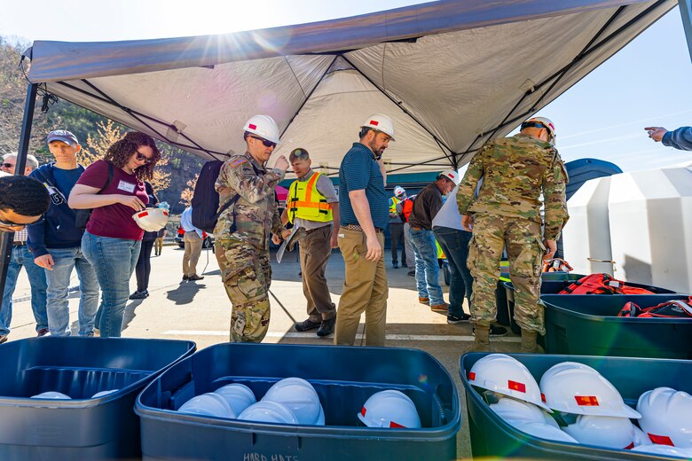 Members of the Inland Waterways Users Board grab hard hats and life jackets for a tour of the Monongahela River Locks and Dam 4 at Charleroi, Pennsylvania, April 12, 2023.

The U.S. Army Corps of Engineers Pittsburgh District hosted the tour and several briefings about ongoing and future inland navigation construction projects within the district.

During the tour, Inland Waterways User Board (IWUB) members learned about the overall Lower Monongahela River navigation project and the new river chamber construction at Charleroi, which is in its final phase after nearly 20 years of construction. Members also listened to briefings about the overall Upper Ohio navigation project and its first major construction contract, the new Montgomery lock construction. 

IWUB is an industry federal-advisory committee representing all fuel-taxed inland waterway systems within the United States. The navigation industry contributes to the Inland Waterways Trust Fund through fuel taxes paid by carriers who transport bulk commodities on the inland waterway system. The board makes recommendations to Congress and the Assistant Secretary of the Army for Civil Works on how best to invest federal and trust funds dollars to keep the most cost-effective, environmentally friendly, and safest form of transportation for bulk commodities resilient and reliable.
(U.S. Army Corps of Engineers Pittsburgh District photo by Michel Sauret)