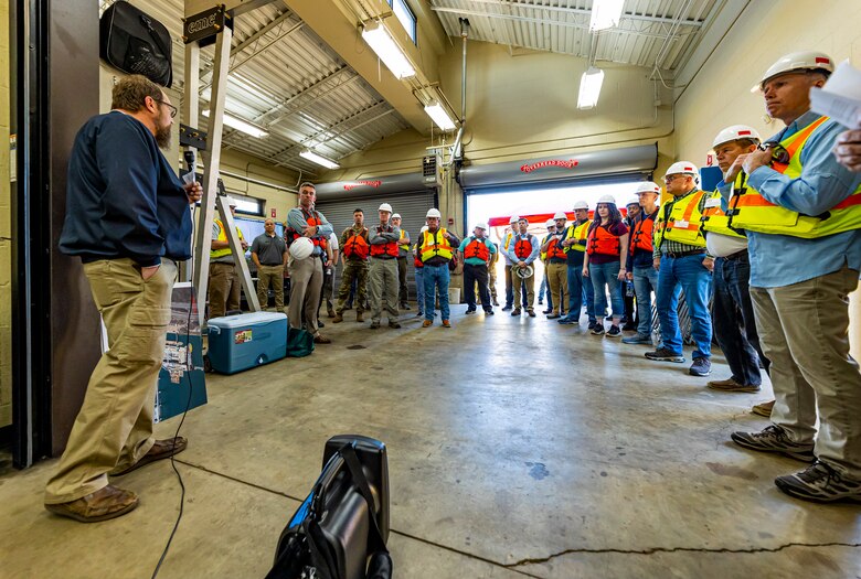 John Dilla, chief of the Locks and Dams Branch of the U.S. Army Corps of Engineers Pittsburgh District, welcomes members of the Inland Waterways Users Board to start a tour of the Monongahela River Locks and Dam 4 at Charleroi, Pennsylvania, April 12, 2023.

The U.S. Army Corps of Engineers Pittsburgh District hosted the tour and several briefings about ongoing and future inland navigation construction projects within the district.

During the tour, Inland Waterways User Board (IWUB) members learned about the overall Lower Monongahela River navigation project and the new river chamber construction at Charleroi, which is in its final phase after nearly 20 years of construction. Members also listened to briefings about the overall Upper Ohio navigation project and its first major construction contract, the new Montgomery lock construction. 

IWUB is an industry federal-advisory committee representing all fuel-taxed inland waterway systems within the United States. The navigation industry contributes to the Inland Waterways Trust Fund through fuel taxes paid by carriers who transport bulk commodities on the inland waterway system. The board makes recommendations to Congress and the Assistant Secretary of the Army for Civil Works on how best to invest federal and trust funds dollars to keep the most cost-effective, environmentally friendly, and safest form of transportation for bulk commodities resilient and reliable.
(U.S. Army Corps of Engineers Pittsburgh District photo by Michel Sauret)