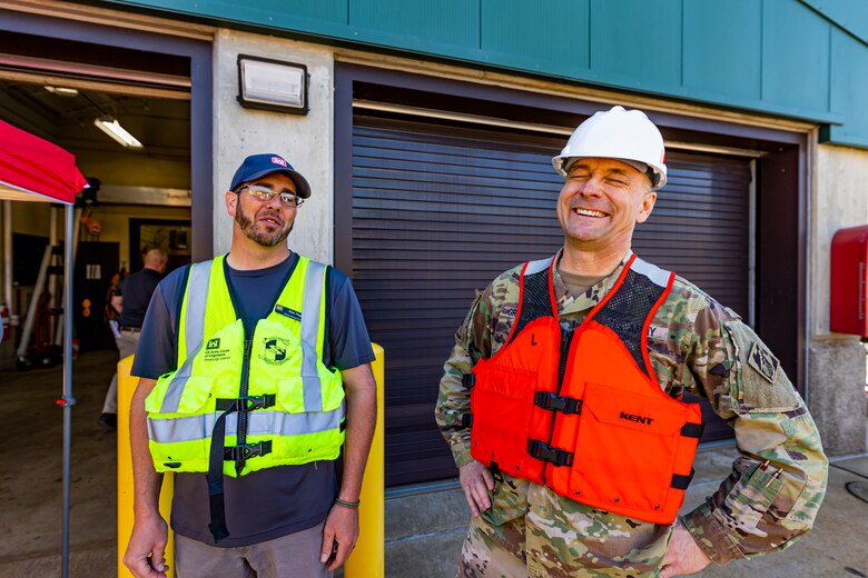 Maj. Gen. William Graham (right), deputy commanding general for Civil and Emergency Operations for the U.S. Army Corps of Engineers, shares a laugh with Alan Nogy, lockmaster of the Monongahela River Locks and Dam 4 at Charleroi, Pennsylvania, April 12, 2023.

The U.S. Army Corps of Engineers Pittsburgh District hosted the tour and several briefings about ongoing and future inland navigation construction projects within the district.

During the tour, Inland Waterways User Board (IWUB) members learned about the overall Lower Monongahela River navigation project and the new river chamber construction at Charleroi, which is in its final phase after nearly 20 years of construction. Members also listened to briefings about the overall Upper Ohio navigation project and its first major construction contract, the new Montgomery lock construction. 

IWUB is an industry federal-advisory committee representing all fuel-taxed inland waterway systems within the United States. The navigation industry contributes to the Inland Waterways Trust Fund through fuel taxes paid by carriers who transport bulk commodities on the inland waterway system. The board makes recommendations to Congress and the Assistant Secretary of the Army for Civil Works on how best to invest federal and trust funds dollars to keep the most cost-effective, environmentally friendly, and safest form of transportation for bulk commodities resilient and reliable.
(U.S. Army Corps of Engineers Pittsburgh District photo by Michel Sauret)