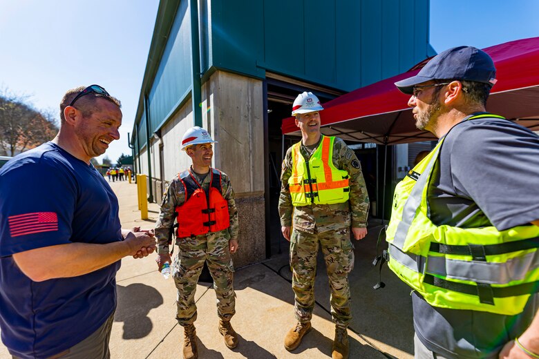 Col. Adam Czekanski (center left), commander of the U.S. Army Corps of Engineers Pittsburgh District, and Col. Nicholas Melin (center right), on the Joint Staff at the Pentagon and next commander of the Pittsburgh District, share a laugh Alan Nogy (right) and Jay Kochuga (left)with district employees during a visit with the Inland Waterways Users Board on a tour of the Monongahela River Locks and Dam 4 at Charleroi, Pennsylvania, April 12, 2023.

The U.S. Army Corps of Engineers Pittsburgh District hosted the tour and several briefings about ongoing and future inland navigation construction projects within the district.

During the tour, Inland Waterways User Board (IWUB) members learned about the overall Lower Monongahela River navigation project and the new river chamber construction at Charleroi, which is in its final phase after nearly 20 years of construction. Members also listened to briefings about the overall Upper Ohio navigation project and its first major construction contract, the new Montgomery lock construction. 

IWUB is an industry federal-advisory committee representing all fuel-taxed inland waterway systems within the United States. The navigation industry contributes to the Inland Waterways Trust Fund through fuel taxes paid by carriers who transport bulk commodities on the inland waterway system. The board makes recommendations to Congress and the Assistant Secretary of the Army for Civil Works on how best to invest federal and trust funds dollars to keep the most cost-effective, environmentally friendly, and safest form of transportation for bulk commodities resilient and reliable.
(U.S. Army Corps of Engineers Pittsburgh District photo by Michel Sauret)