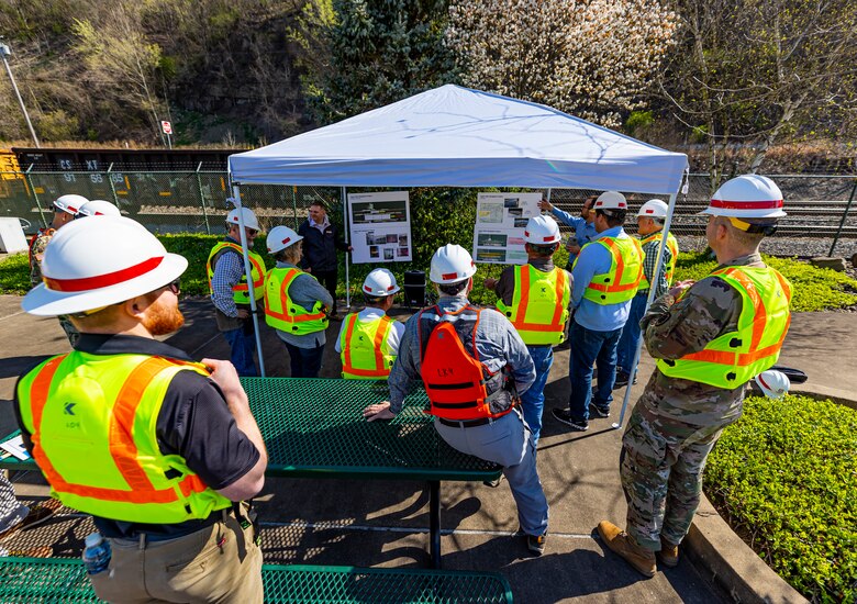 Members of the Inland Waterways Users Board receive a briefing from project managers Chris Dening and Jesse Bisnette on the Upper Ohio navigation project within the U.S. Army Corps of Engineers Pittsburgh District while touring the Monongahela River Locks and Dam 4 at Charleroi, Pennsylvania, April 12, 2023.

The U.S. Army Corps of Engineers Pittsburgh District hosted the tour and several briefings about ongoing and future inland navigation construction projects within the district.

During the tour, Inland Waterways User Board (IWUB) members learned about the overall Lower Monongahela River navigation project and the new river chamber construction at Charleroi, which is in its final phase after nearly 20 years of construction. Members also listened to briefings about the overall Upper Ohio navigation project and its first major construction contract, the new Montgomery lock construction. 

IWUB is an industry federal-advisory committee representing all fuel-taxed inland waterway systems within the United States. The navigation industry contributes to the Inland Waterways Trust Fund through fuel taxes paid by carriers who transport bulk commodities on the inland waterway system. The board makes recommendations to Congress and the Assistant Secretary of the Army for Civil Works on how best to invest federal and trust funds dollars to keep the most cost-effective, environmentally friendly, and safest form of transportation for bulk commodities resilient and reliable.
(U.S. Army Corps of Engineers Pittsburgh District photo by Michel Sauret)