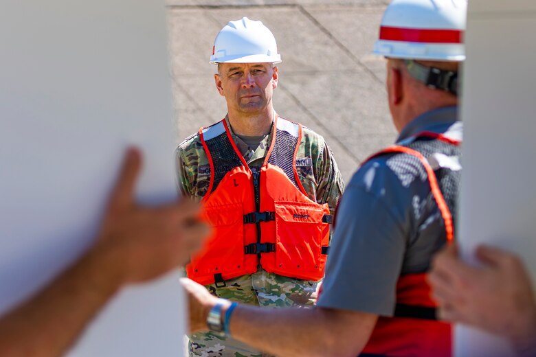 Maj. Gen. William Graham, deputy commanding general for Civil and Emergency Operations for the U.S. Army Corps of Engineers, listens to a brief on the Lower Monongahela River navigation project with members of the Inland Waterways Users Board during a tour of the Monongahela River Locks and Dam 4 at Charleroi, Pennsylvania, April 12, 2023.

The U.S. Army Corps of Engineers Pittsburgh District hosted the tour and several briefings about ongoing and future inland navigation construction projects within the district.

During the tour, Inland Waterways User Board (IWUB) members learned about the overall Lower Monongahela River navigation project and the new river chamber construction at Charleroi, which is in its final phase after nearly 20 years of construction. Members also listened to briefings about the overall Upper Ohio navigation project and its first major construction contract, the new Montgomery lock construction. 

IWUB is an industry federal-advisory committee representing all fuel-taxed inland waterway systems within the United States. The navigation industry contributes to the Inland Waterways Trust Fund through fuel taxes paid by carriers who transport bulk commodities on the inland waterway system. The board makes recommendations to Congress and the Assistant Secretary of the Army for Civil Works on how best to invest federal and trust funds dollars to keep the most cost-effective, environmentally friendly, and safest form of transportation for bulk commodities resilient and reliable.
(U.S. Army Corps of Engineers Pittsburgh District photo by Michel Sauret)