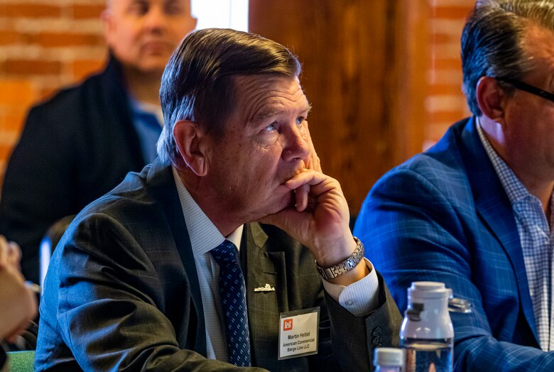 Martin Hettel, vice president of government affairs for the American Commercial Barge Lines, listens to a presentation during the Inland Waterways Users Board meeting in Pittsburgh, April 13, 2023.

The U.S. Army Corps of Engineers Pittsburgh District hosted the tour and several briefings about ongoing and future inland navigation construction projects within the district.

During the tour, Inland Waterways User Board (IWUB) members learned about the overall Lower Monongahela River navigation project and the new river chamber construction at Charleroi, which is in its final phase after nearly 20 years of construction. Members also listened to briefings about the overall Upper Ohio navigation project and its first major construction contract, the new Montgomery lock construction. 

IWUB is an industry federal-advisory committee representing all fuel-taxed inland waterway systems within the United States. The navigation industry contributes to the Inland Waterways Trust Fund through fuel taxes paid by carriers who transport bulk commodities on the inland waterway system. The board makes recommendations to Congress and the Assistant Secretary of the Army for Civil Works on how best to invest federal and trust funds dollars to keep the most cost-effective, environmentally friendly, and safest form of transportation for bulk commodities resilient and reliable.
(U.S. Army Corps of Engineers Pittsburgh District photo by Michel Sauret)